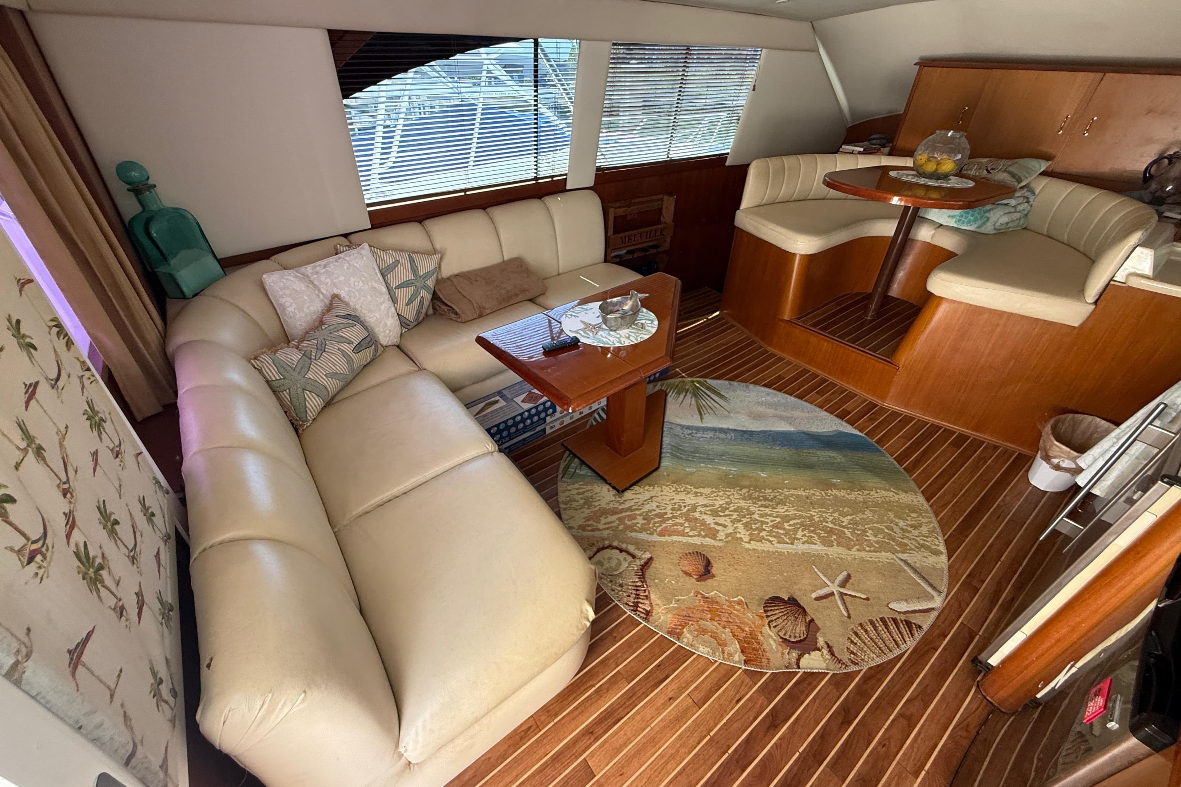 Luxurious 1997 Ocean Yachts 40 Super Sport interior with plush seating and nautical decor.