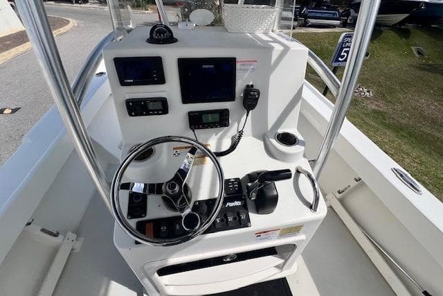 2016 Parker 21SE Center Console boat dashboard with steering wheel and navigation controls.