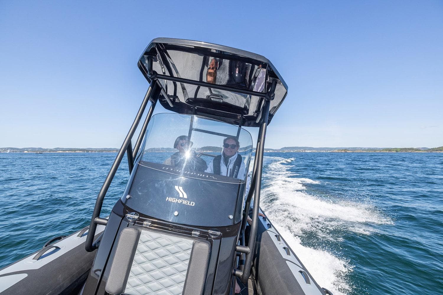 Manufacturer Provided Image: 2025 Highfield Sport 660 boat cruising on open water, clear blue sky.