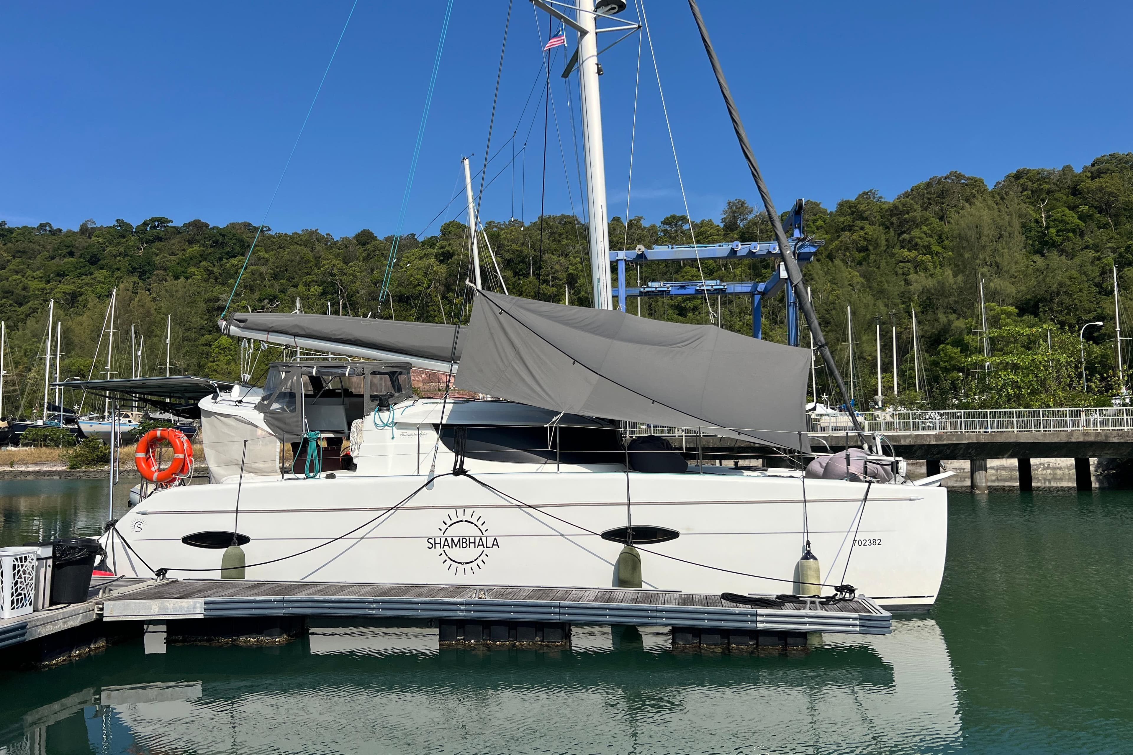 2009 Fountaine Pajot Lipari 41 catamaran docked at marina.
