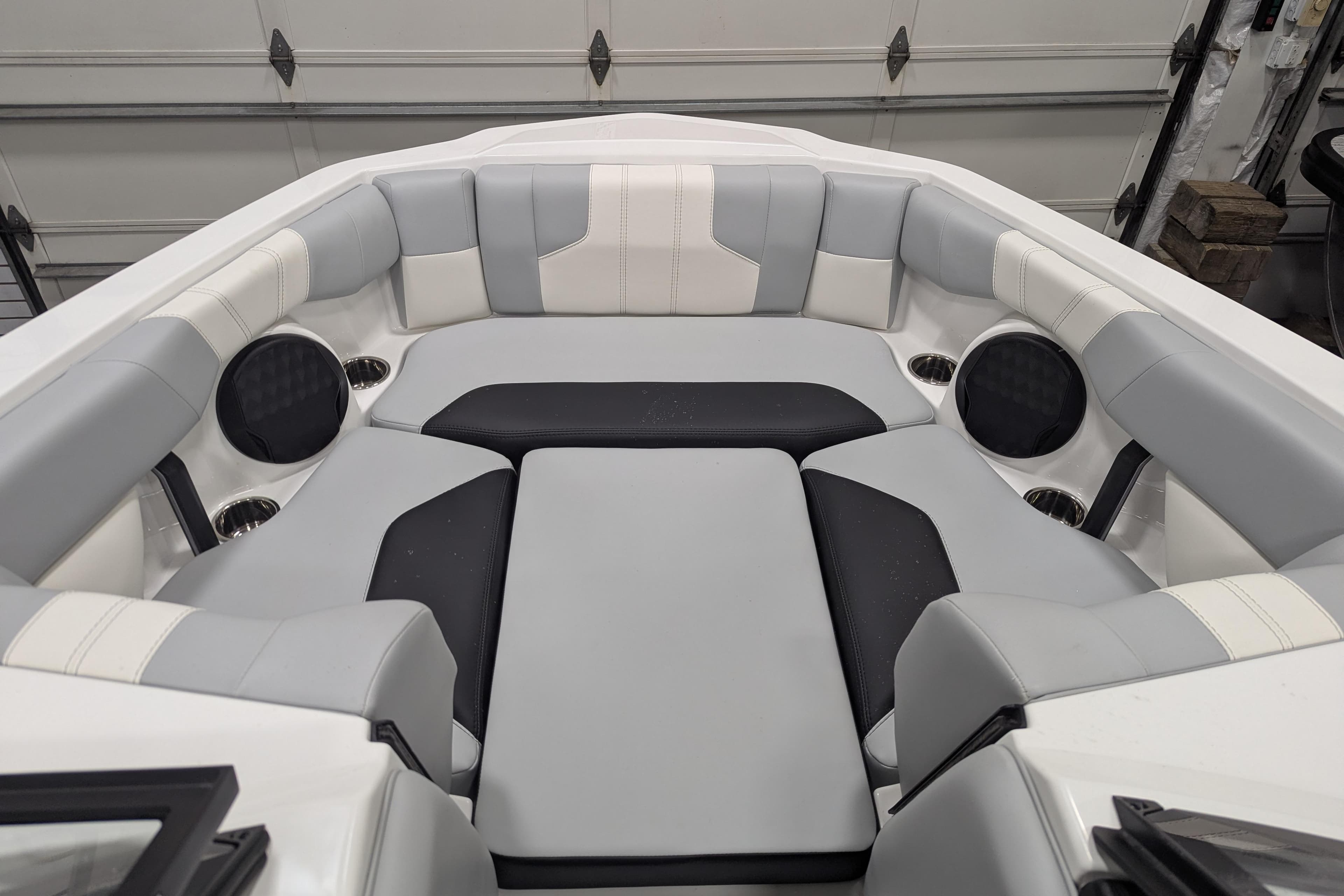2026 Malibu Wakesetter 21 LX interior with gray and black cushioned seating.
