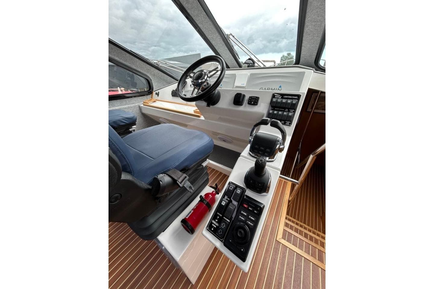 2018 Redbay Boats 1650 Explorer Cabin RIB cockpit with steering wheel and control panel.