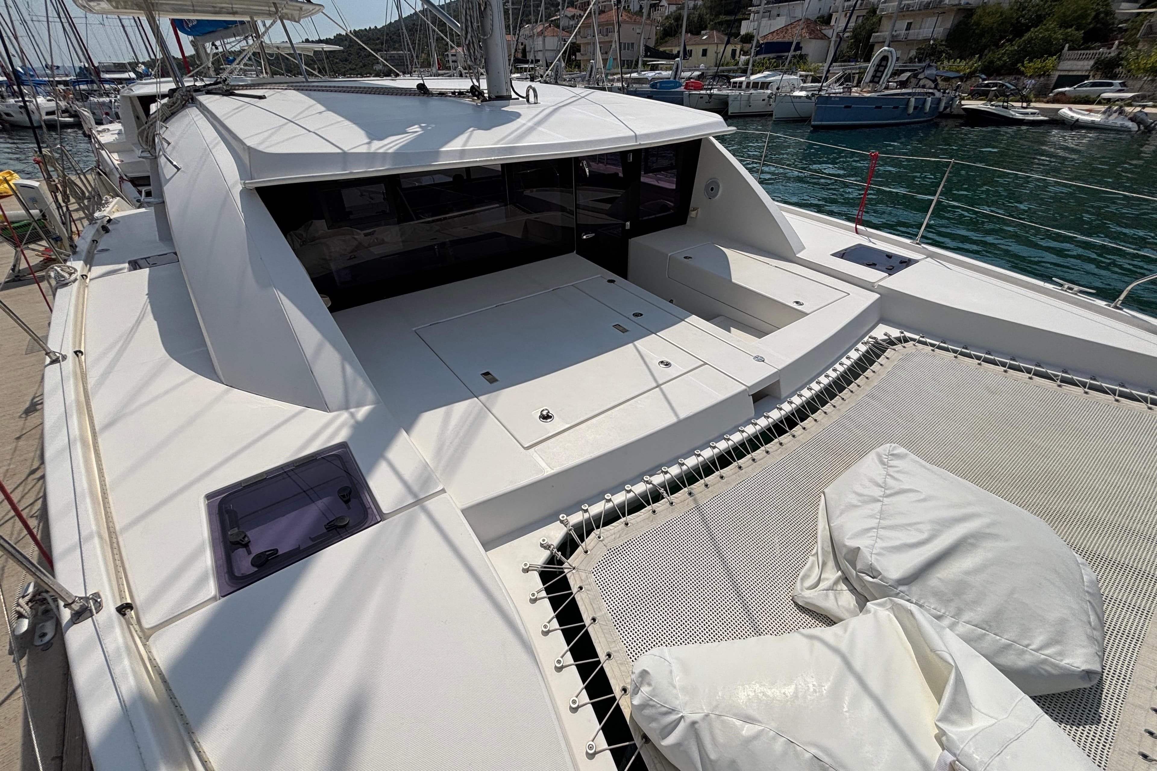2019 Leopard 40 catamaran docked, featuring spacious deck and netting area.