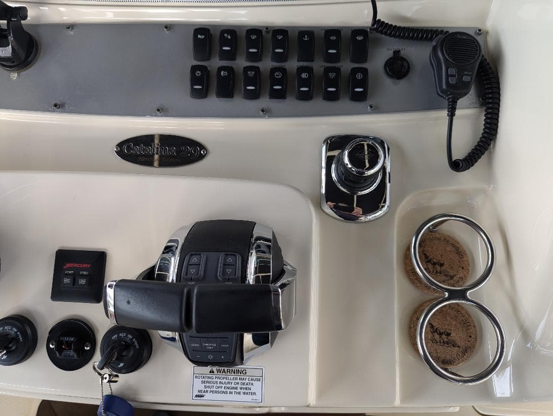 Control panel of 2015 Chris-Craft Catalina 29 boat with switches and throttle.