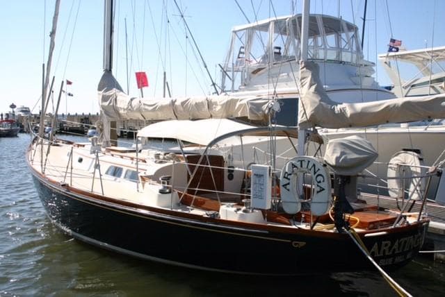 1967 Hinckley Bermuda 40 sailboat docked in a marina, featuring classic design and rigging.
