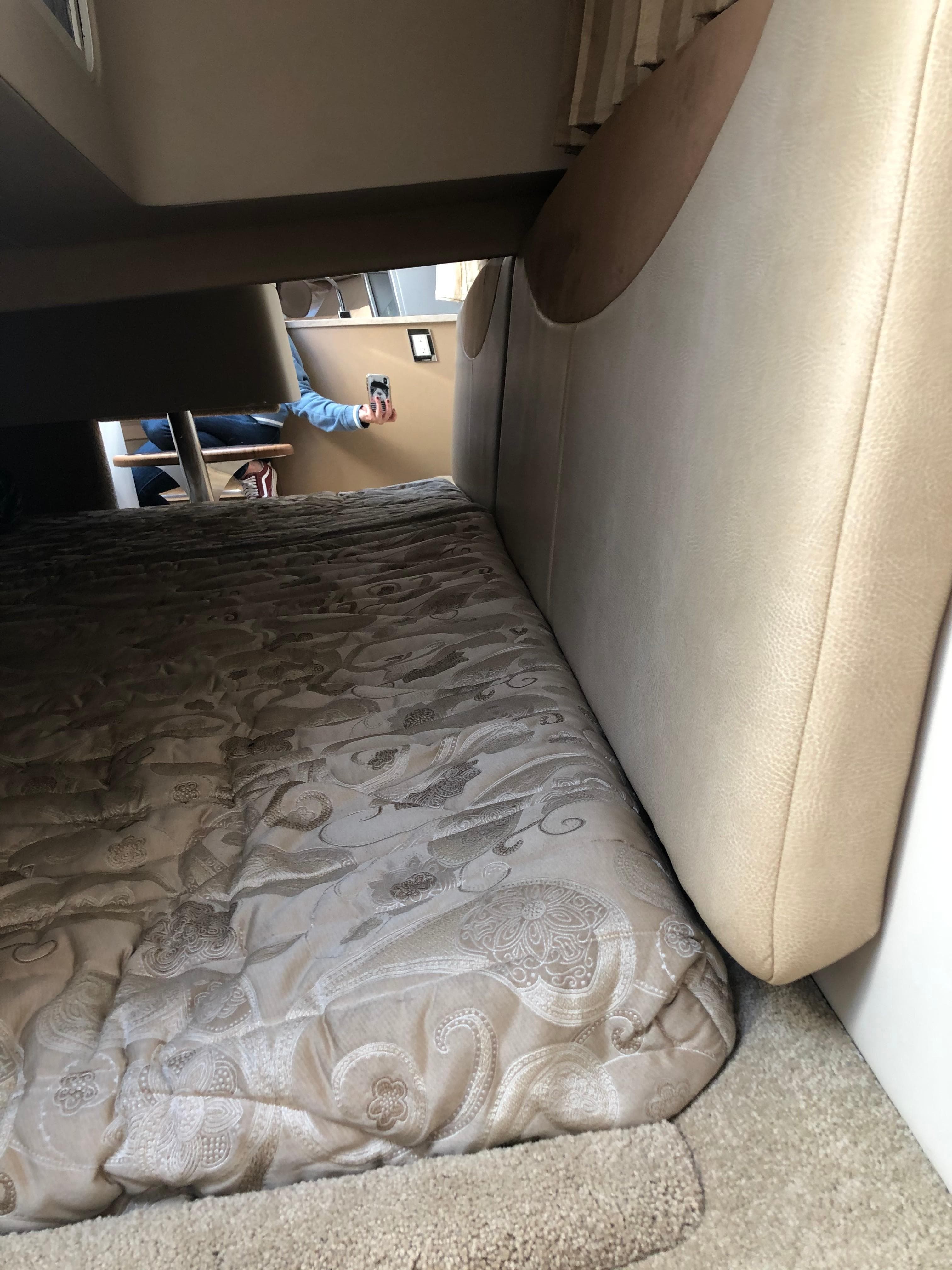 Interior cabin of 2013 Formula 350 Sun Sport with patterned bedding.