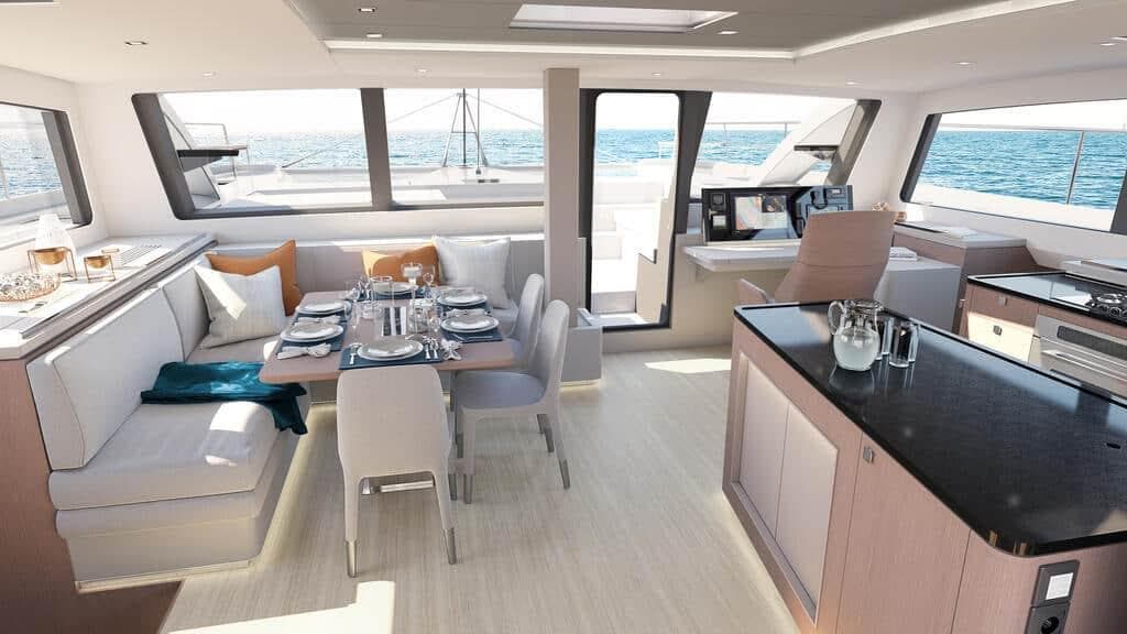 Luxurious interior of 2025 Privilege Signature 580 yacht with dining area and ocean view.