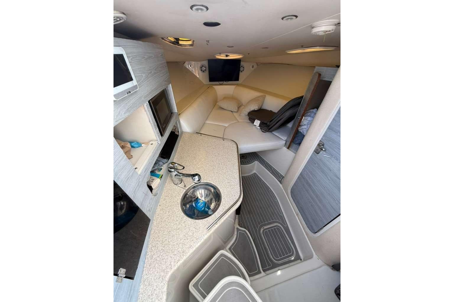 2008 Hydra-Sports Vector 3500 VX cabin interior with kitchenette and seating area.
