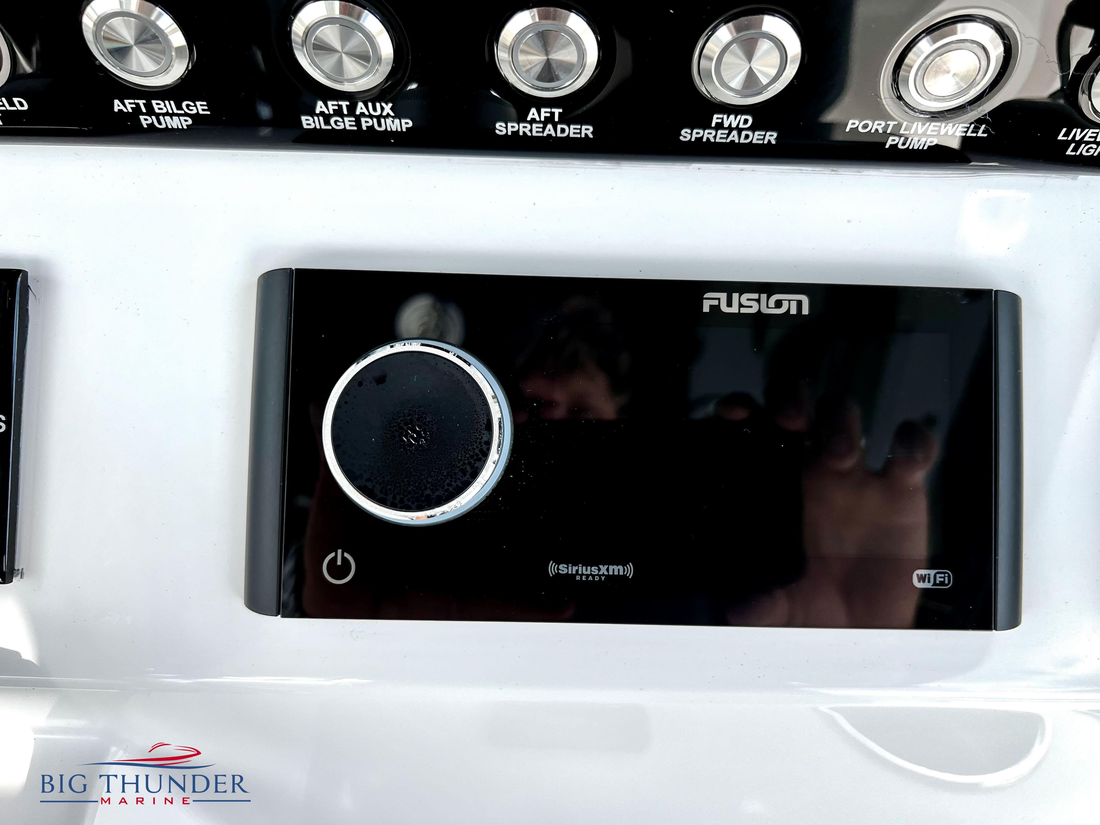 Control panel of a 2023 Fountain 38 TE boat with Fusion audio system.