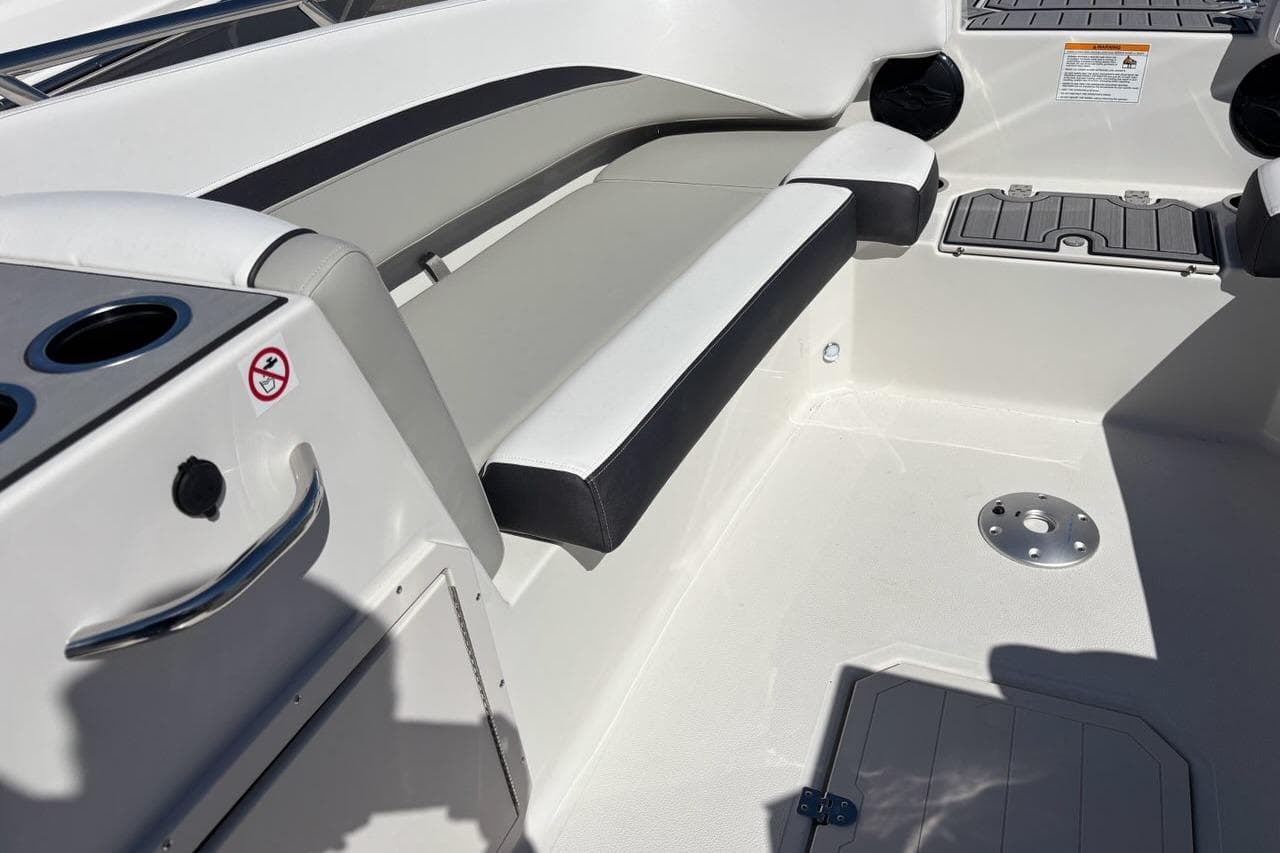 Interior view of 2026 Starcraft SVX 191 OB boat, featuring seating and cup holders.