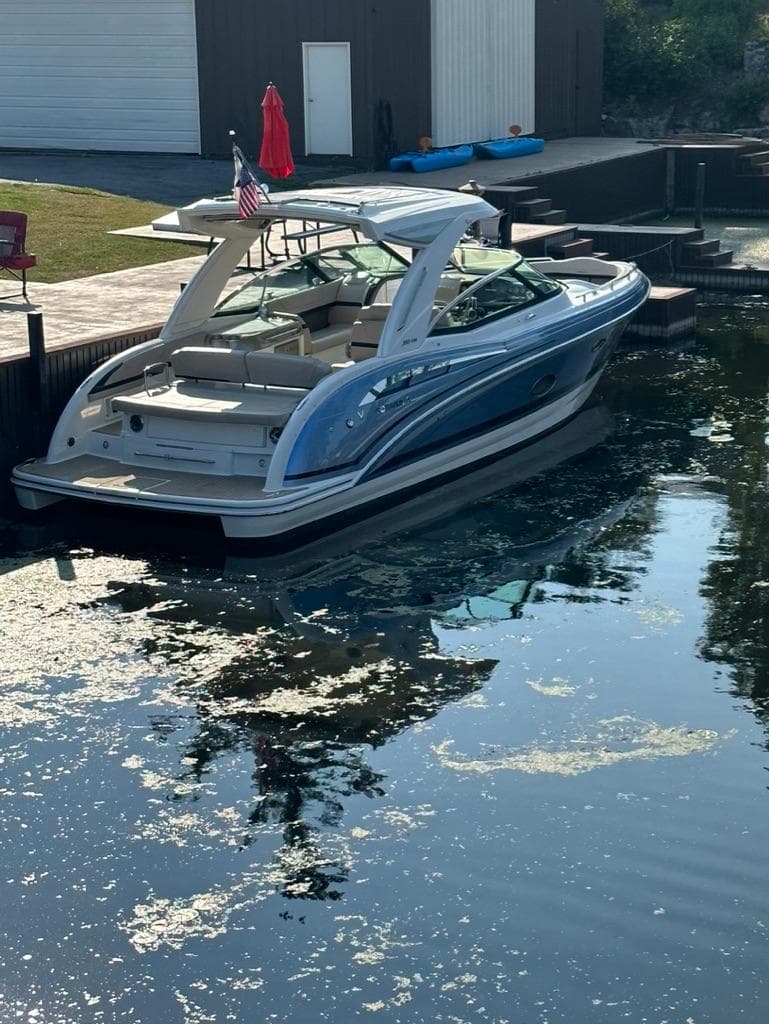 2018 Formula 350 CBR boat docked in a calm, reflective waterway.