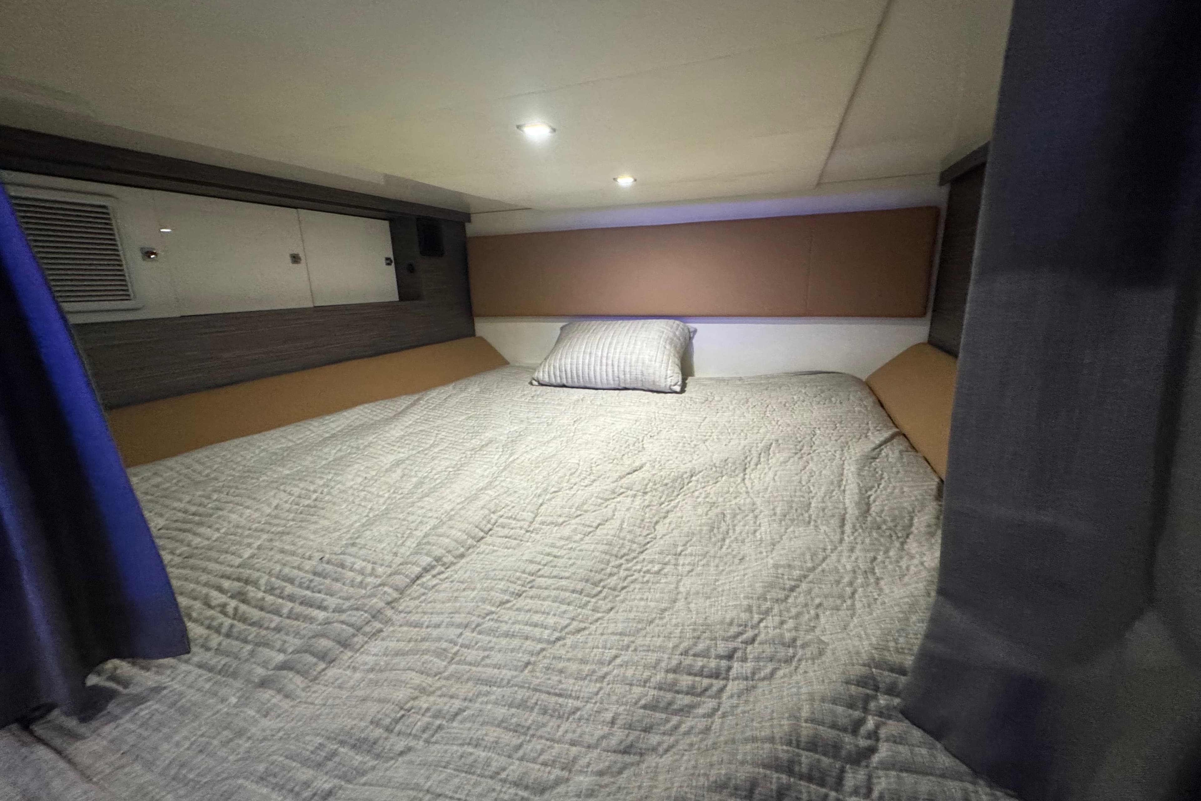 2022 Aviara AV40 OB cabin interior with cozy bed and modern design.