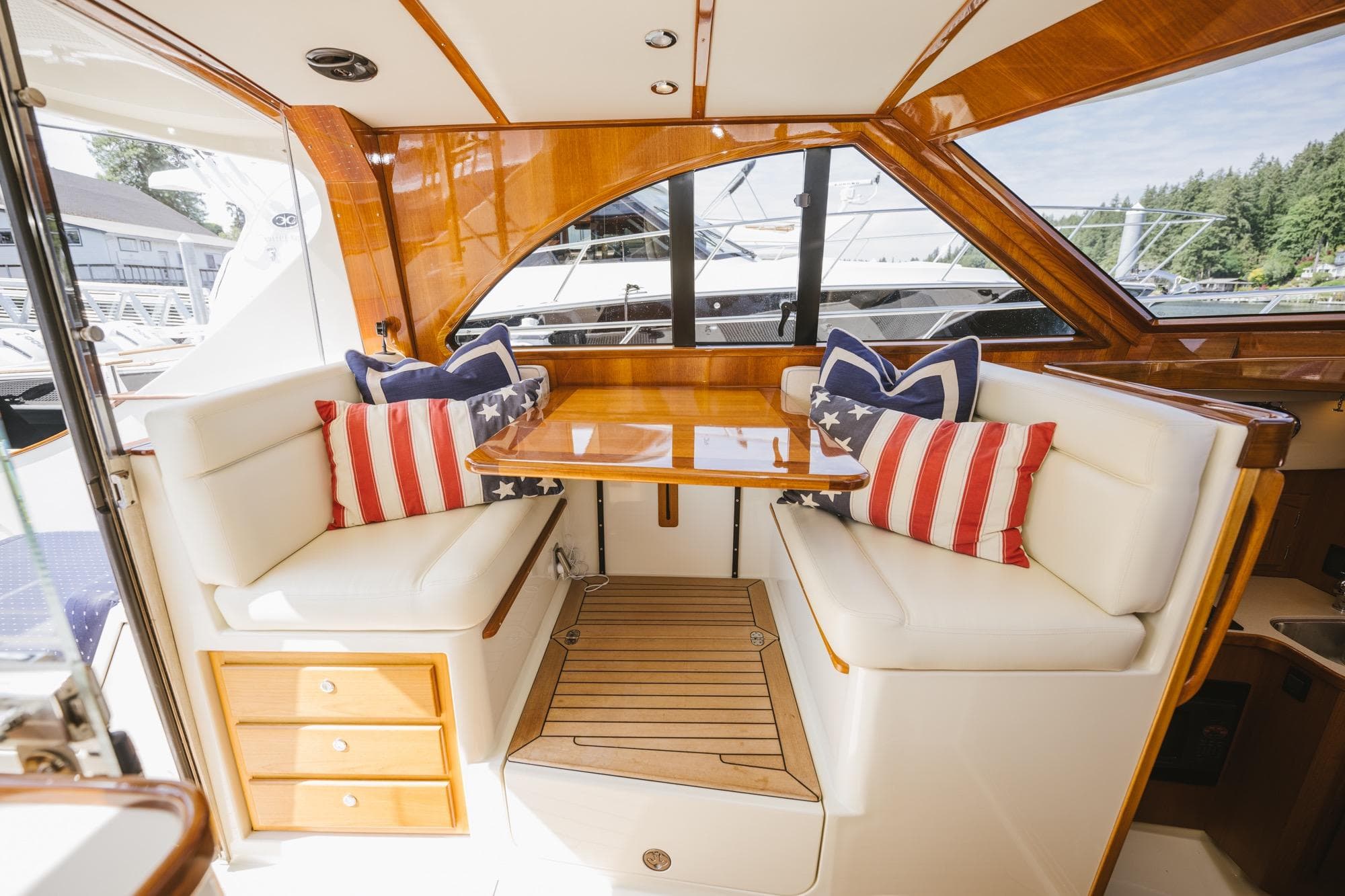 Luxurious 2010 San Juan SJ40FB IPS yacht interior with American flag pillows.