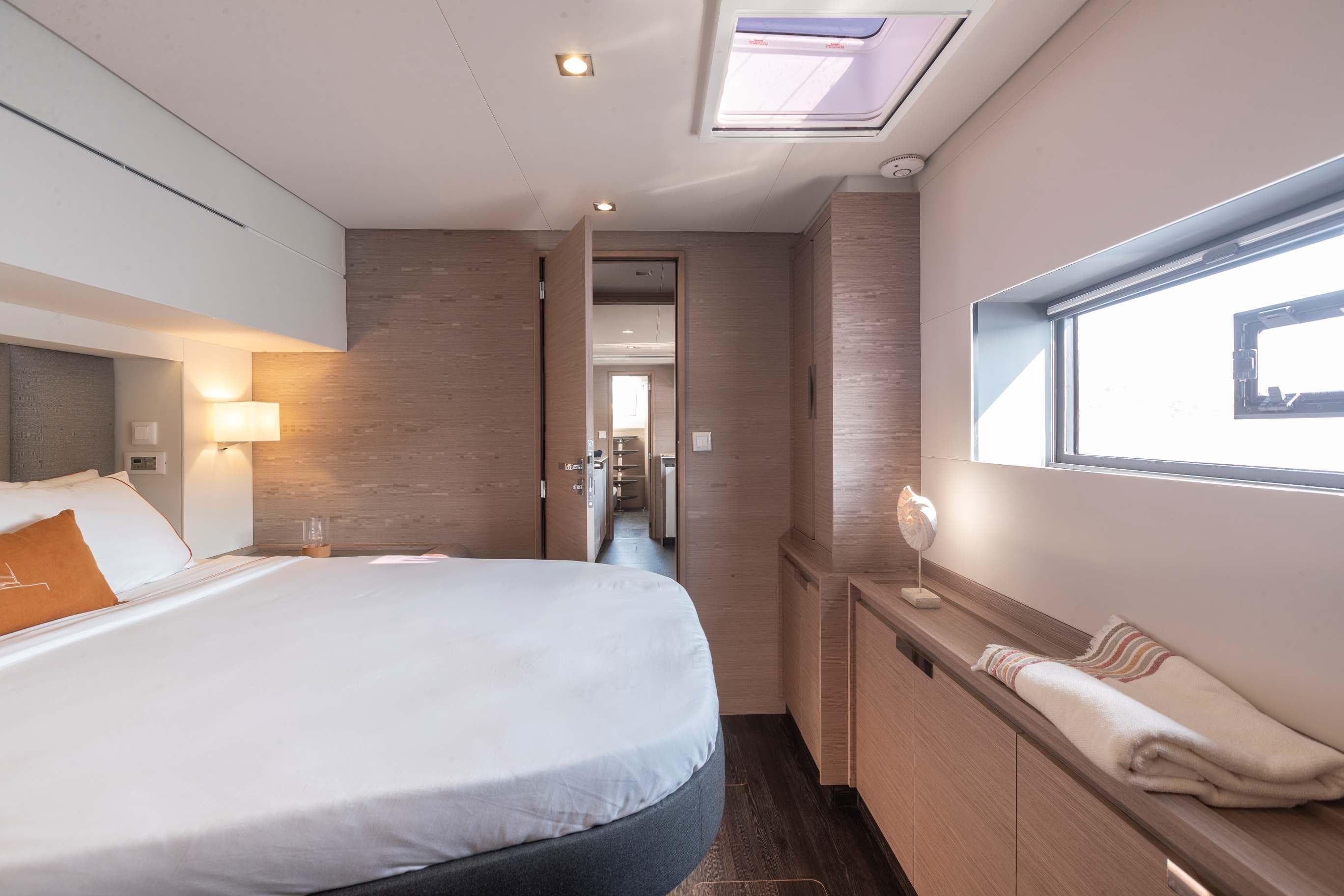 Luxurious cabin interior of 2026 Fountaine Pajot Samana 59 yacht, featuring modern design and cozy ambiance.