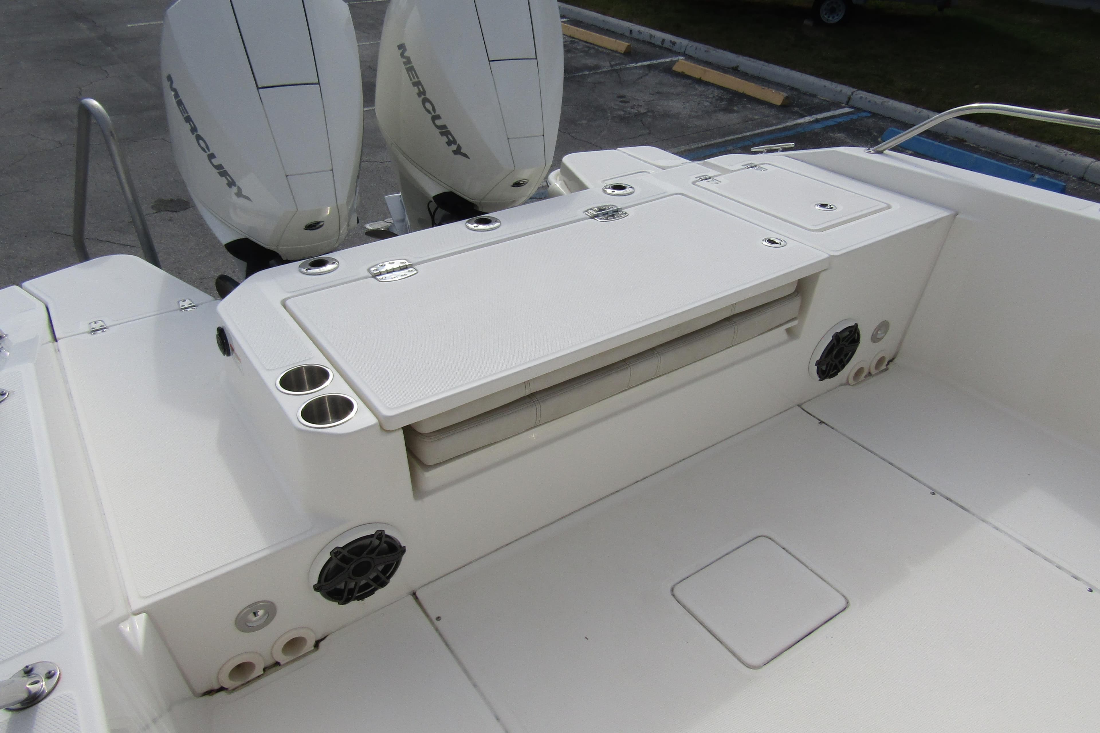 2023 Boston Whaler 280 Dauntless boat deck with dual Mercury engines and seating area.