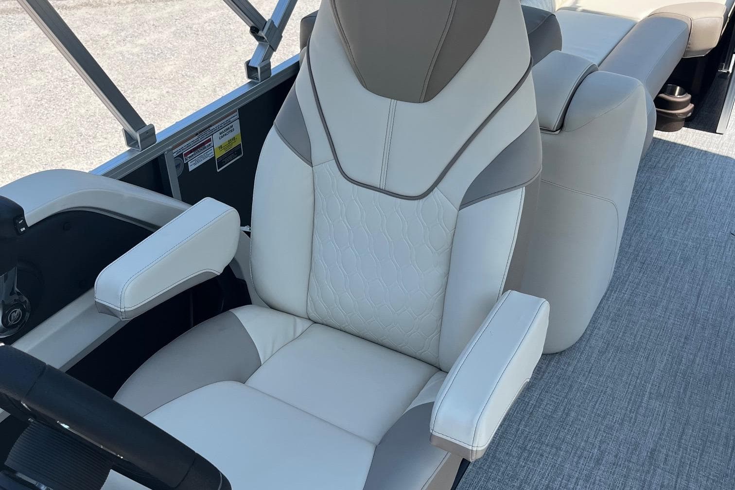 Luxurious seating in 2026 Avalon 25 LSZ Quad Lounger boat, featuring elegant design and comfort.
