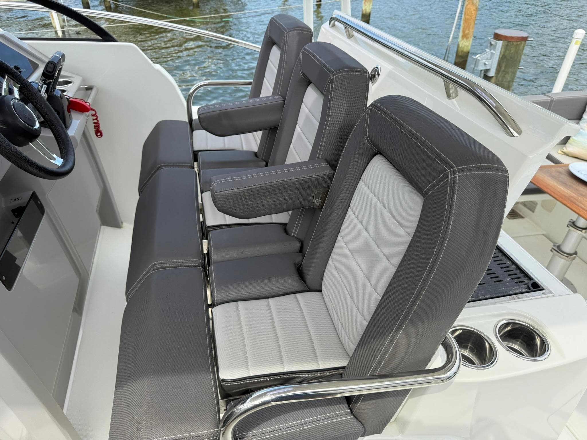 2018 Jeanneau Leader 10.5 boat interior with sleek seating and steering wheel.