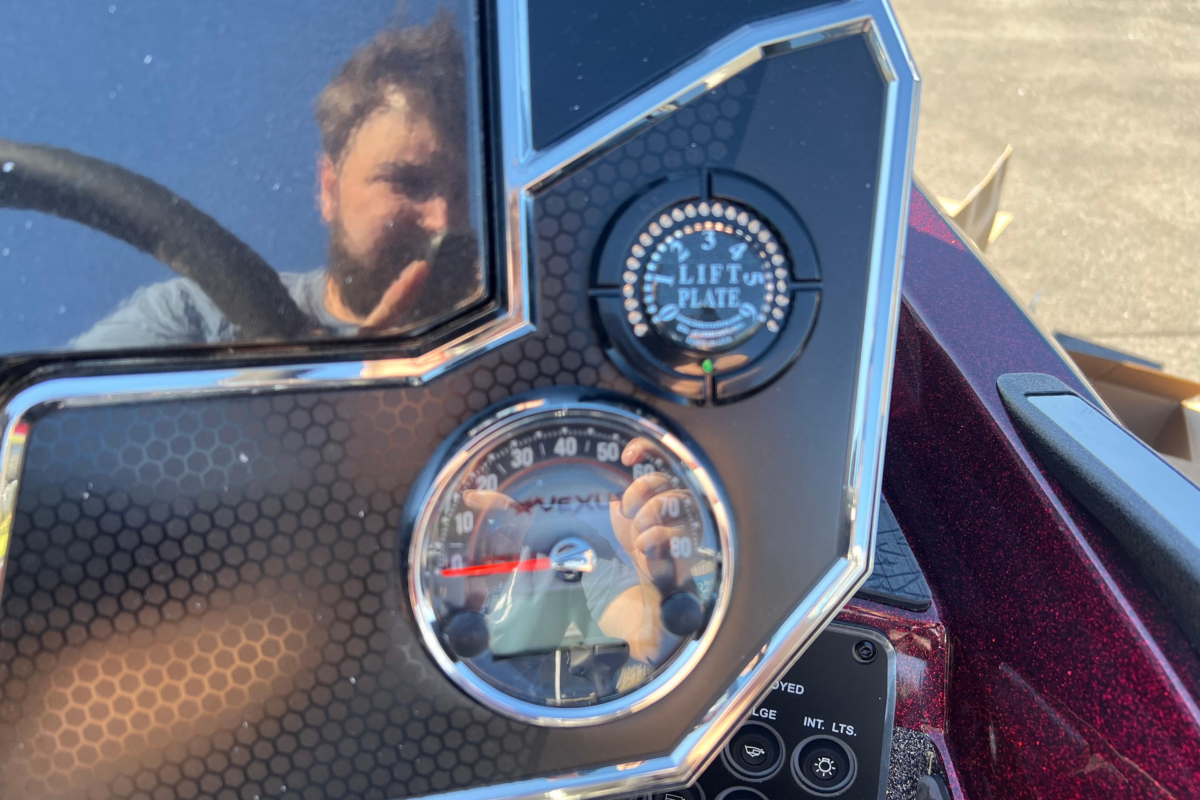 Dashboard of a 2026 Vexus VXS20 boat with lift plate and speedometer.