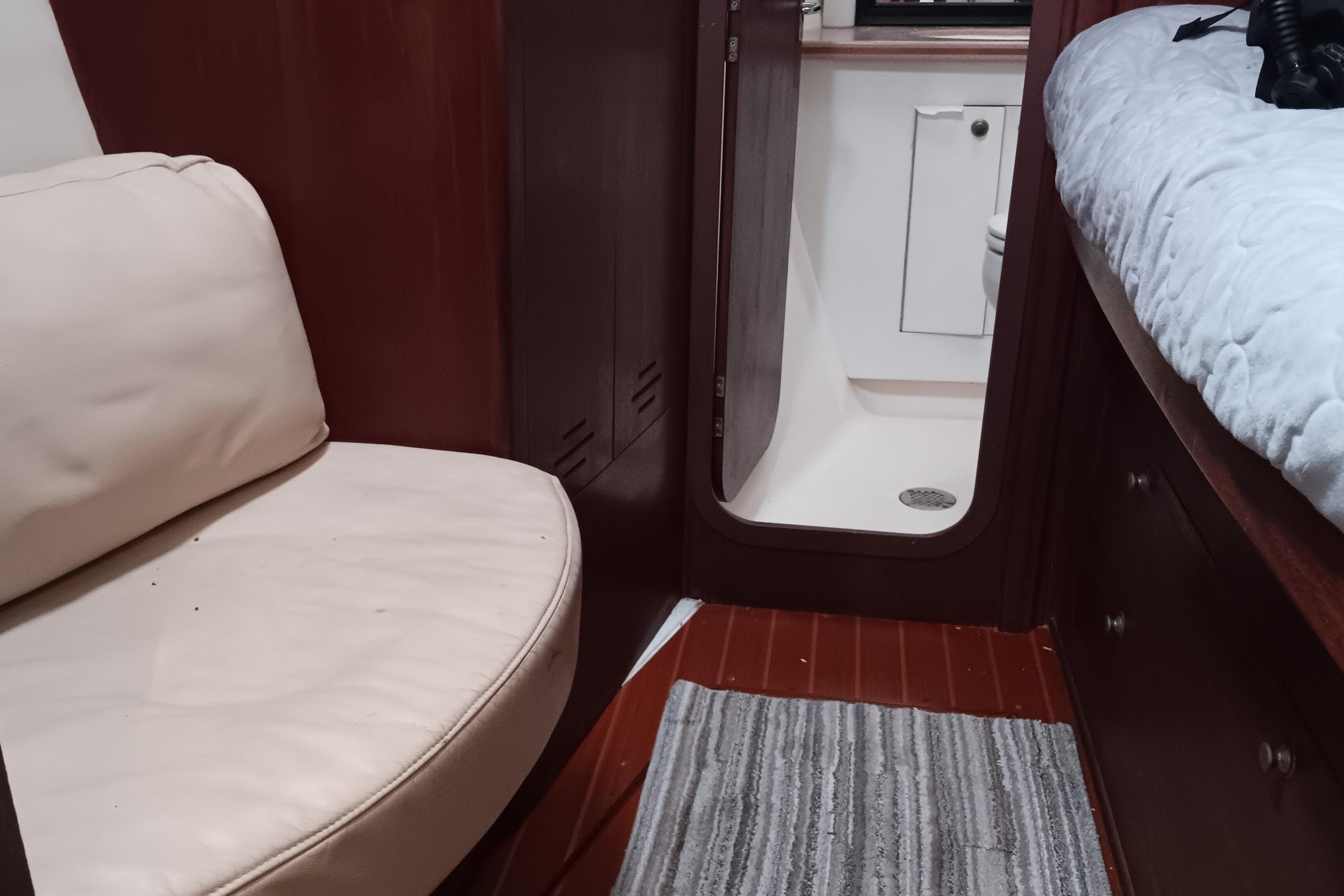Interior of 1998 Hunter Passage 450 yacht with seating and cabin view.
