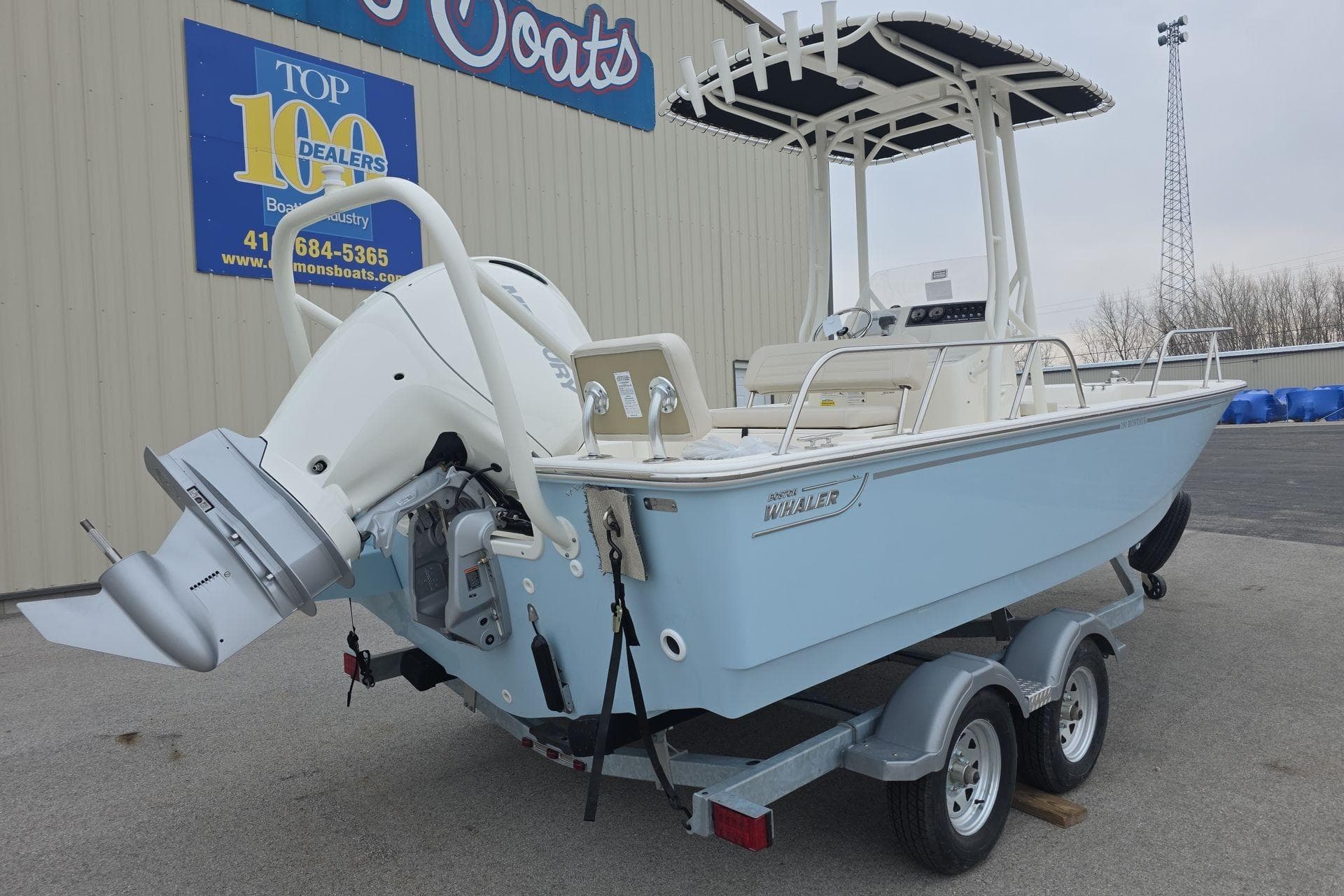 2026 Boston Whaler 190 Montauk boat on trailer, displayed at dealership.
