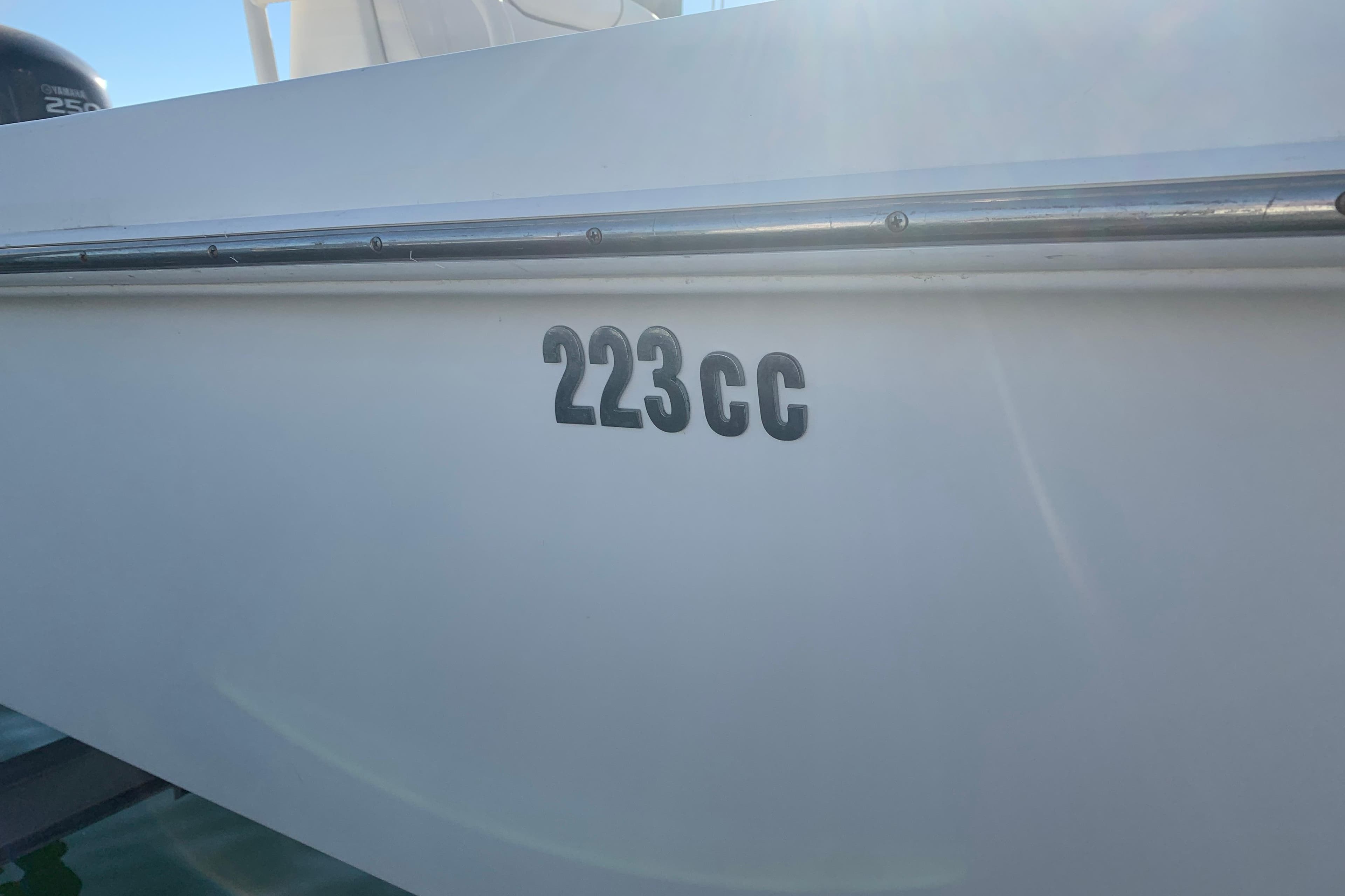 2008 Everglades 223 Center Console boat, side view with model number "223cc" visible.