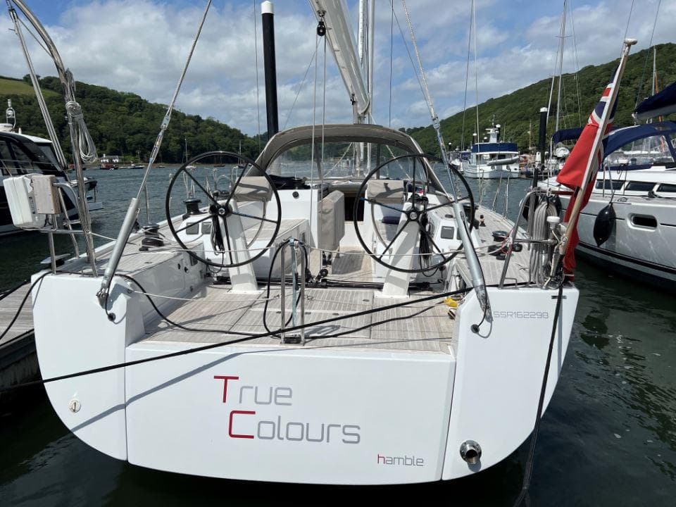 2015 Grand Soleil 50 sailboat "True Colours" docked in a scenic marina.