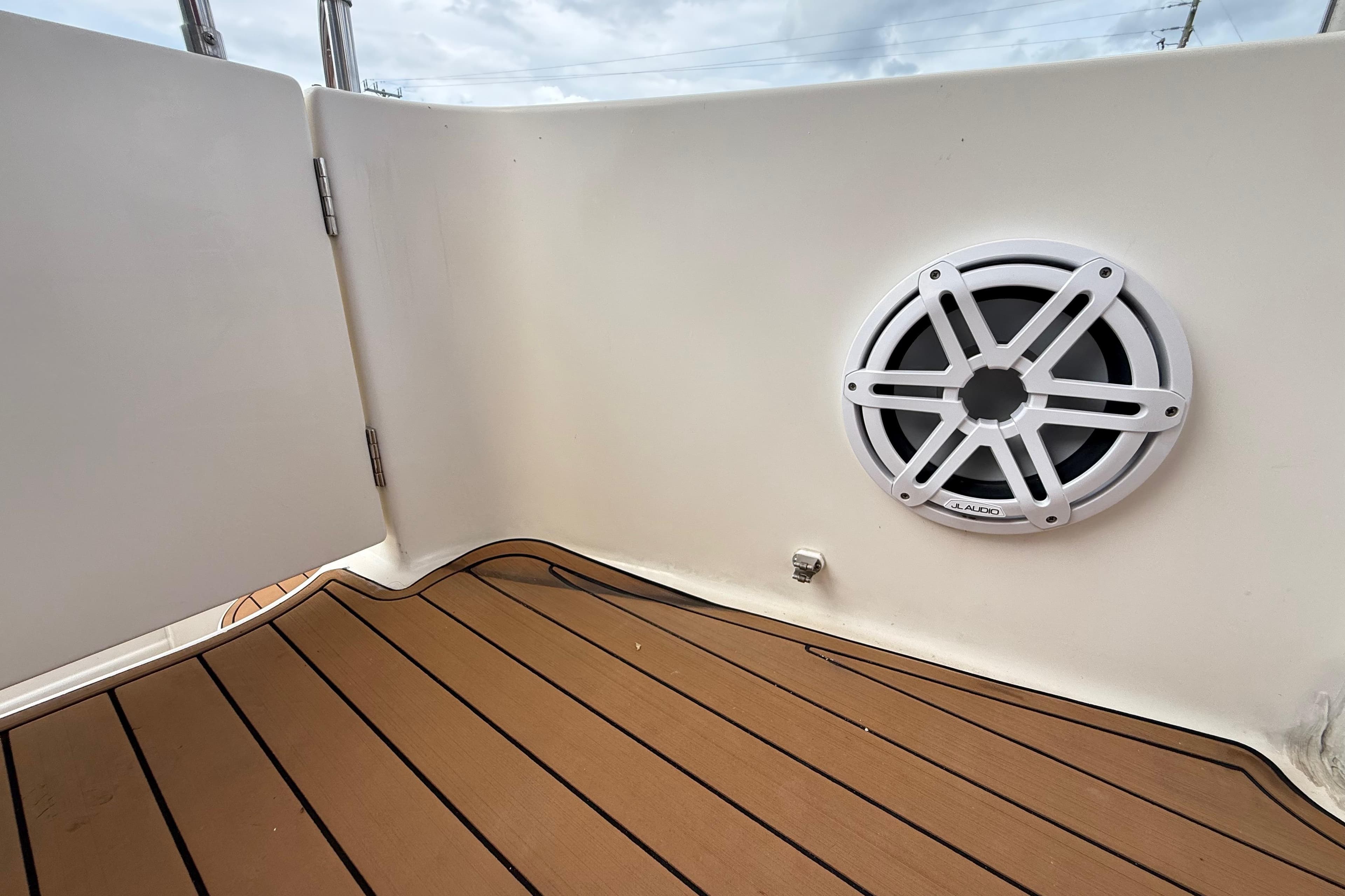 2007 Meridian 459 Motoryacht deck with JL Audio speaker and teak flooring.