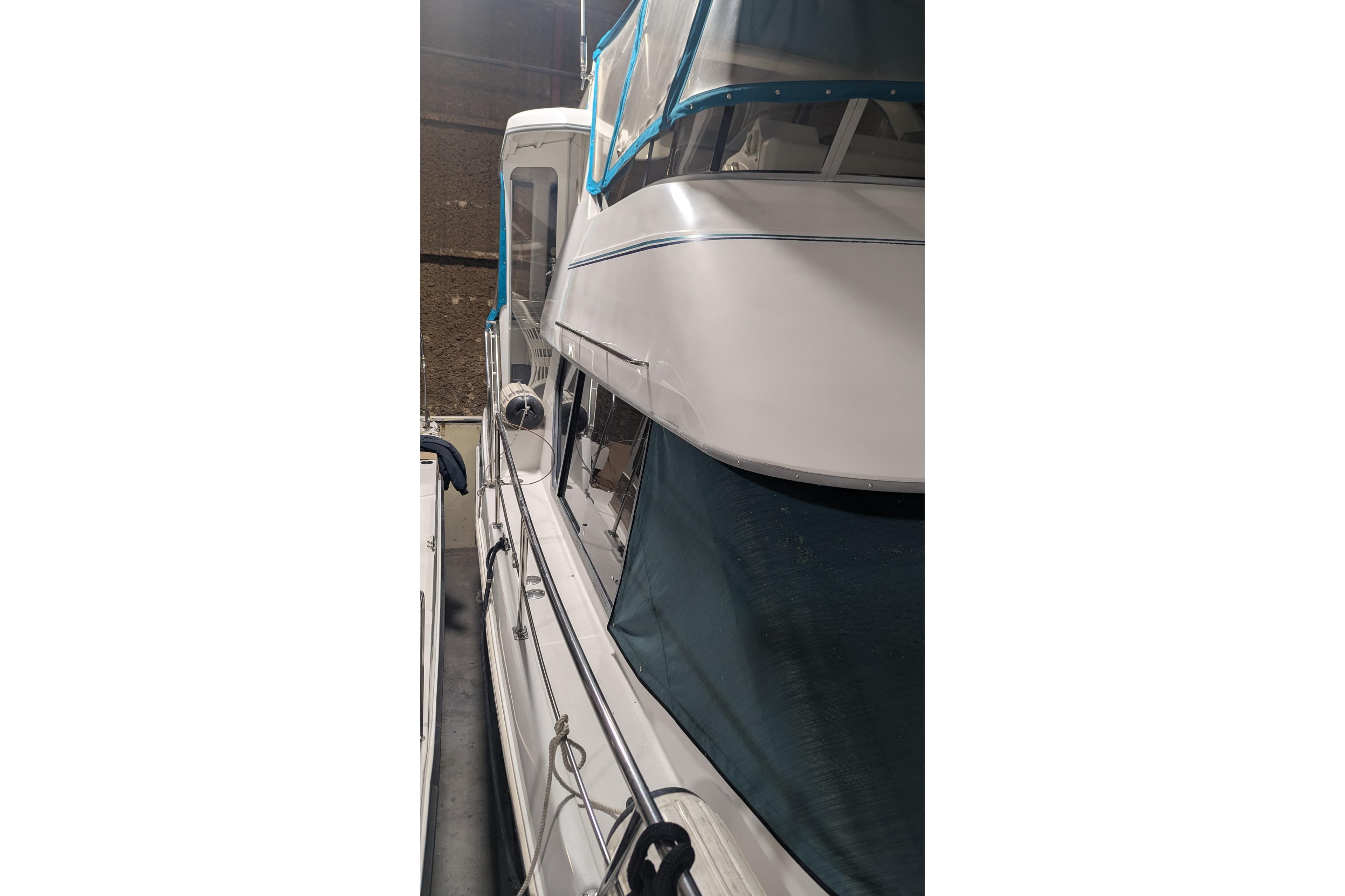 1996 Carver 355 Aft Cabin Motor Yacht, side view in storage.