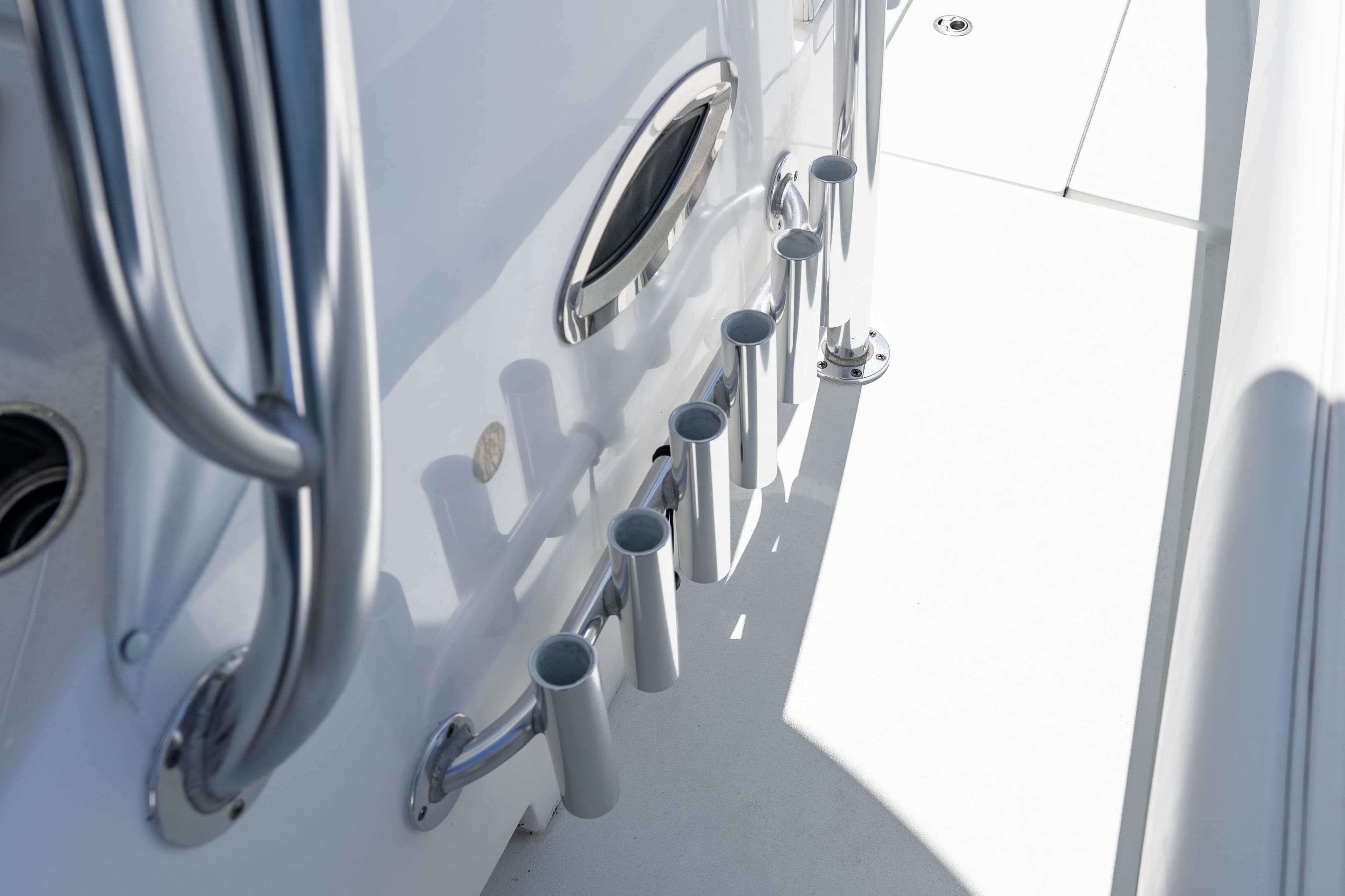2022 Contender 35 ST boat with stainless steel rod holders and sleek design.