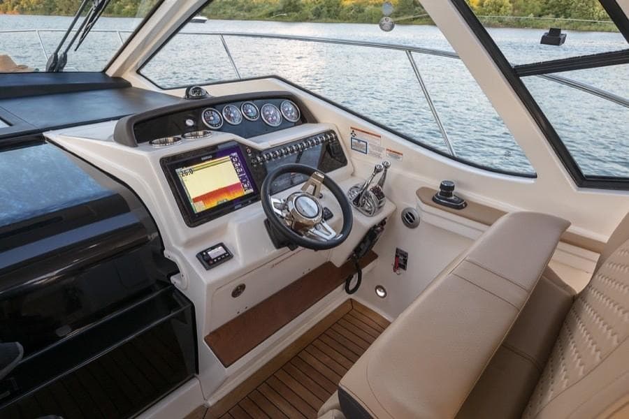Manufacturer Provided Image: 2021 Sea Ray Sundancer 350 Coupe helm with modern navigation system and luxurious seating.
