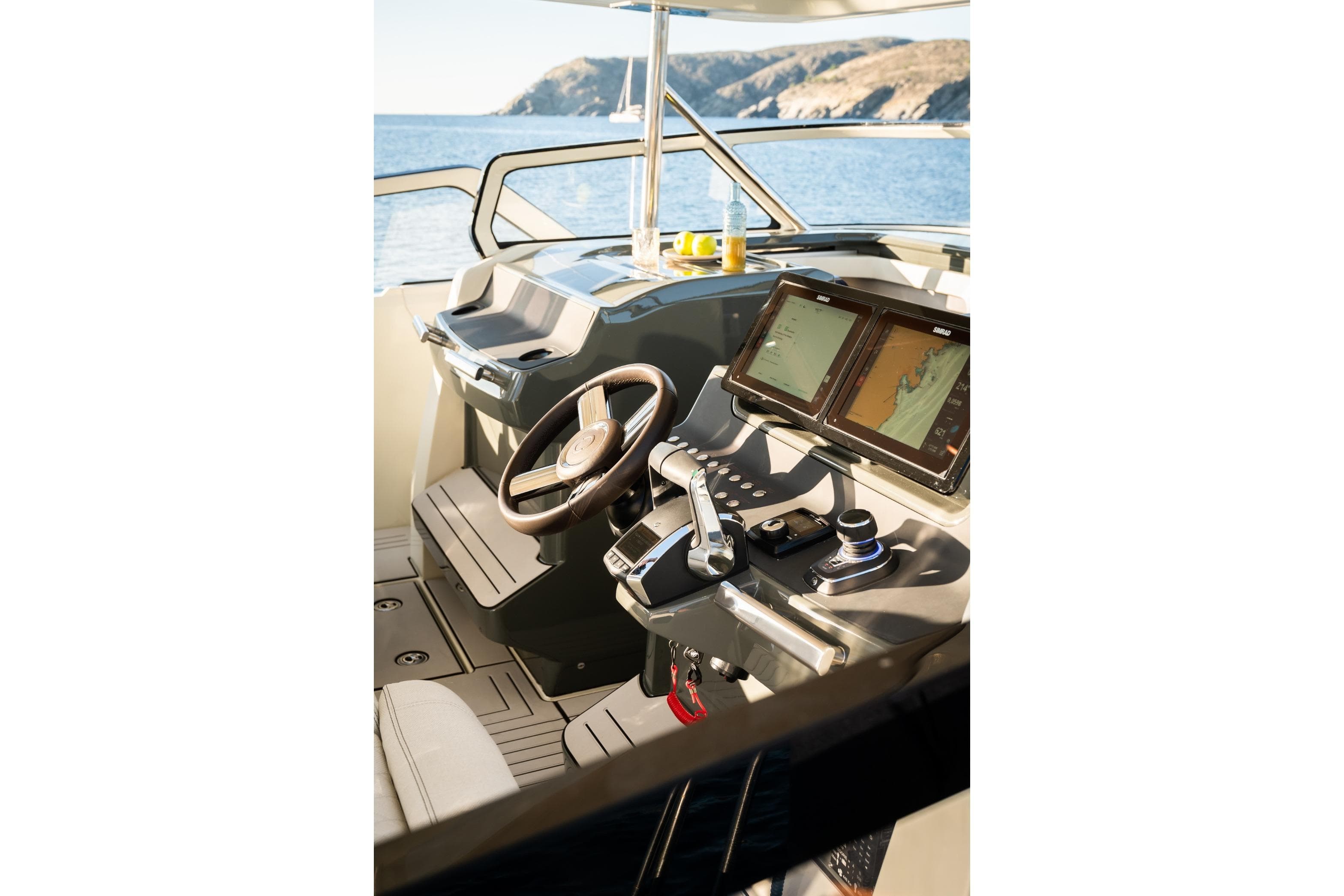 Interior of 2026 YOT 36 boat with modern navigation system and steering wheel.