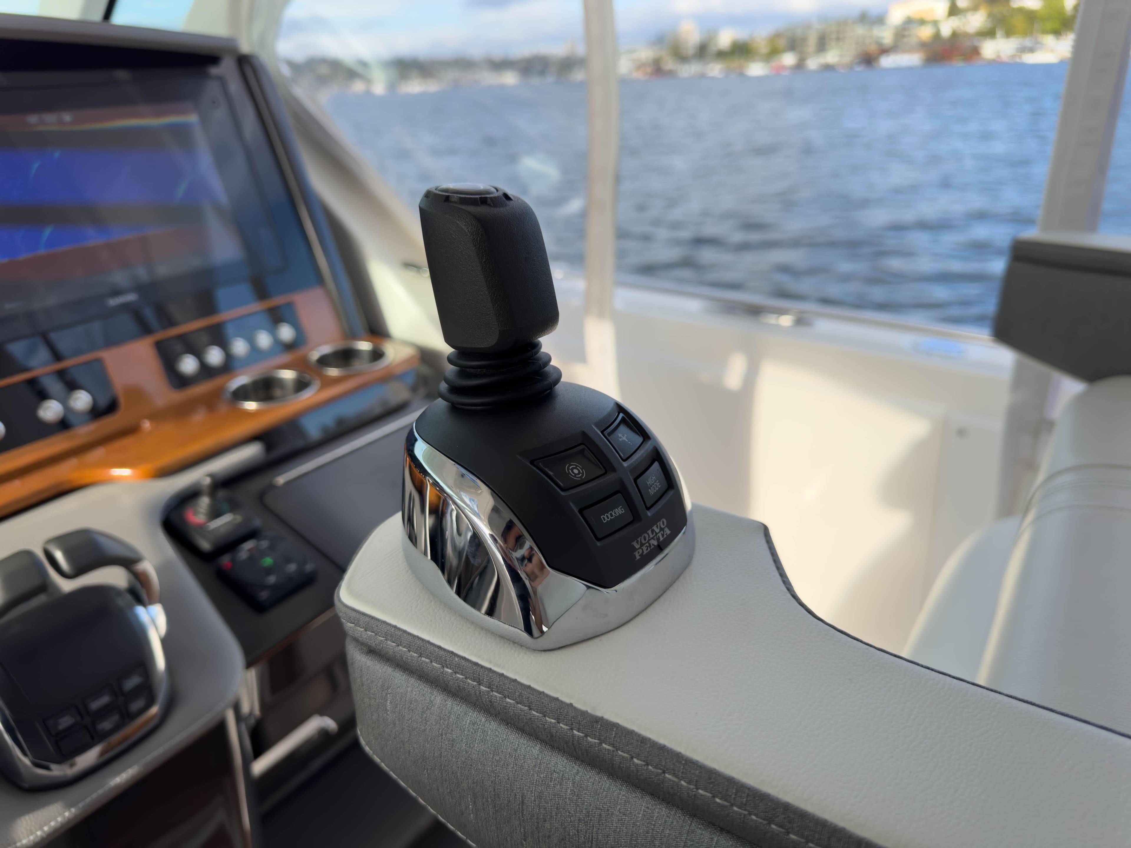 Tiara Sport 38 LS 2020 boat joystick control with scenic water view.