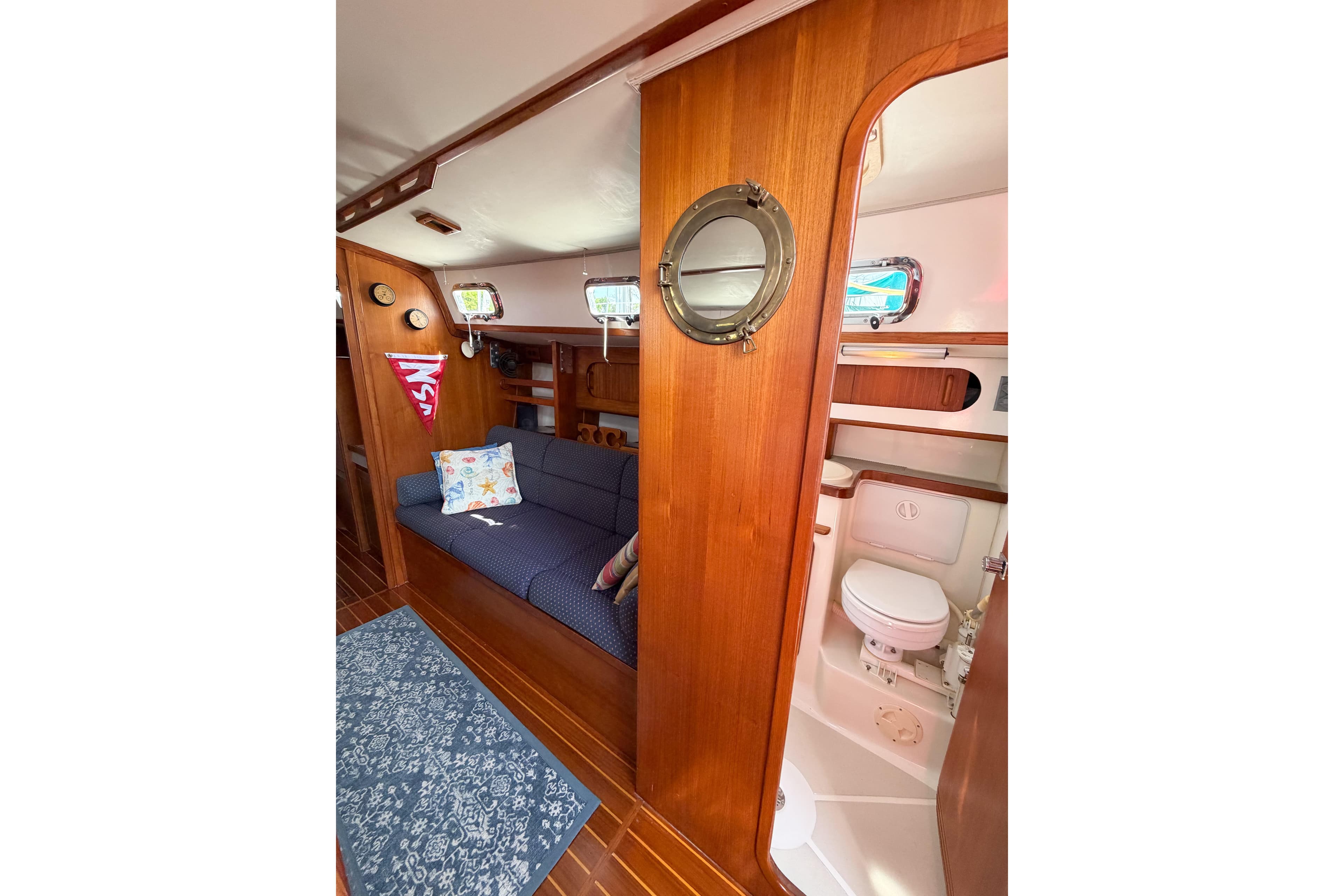 Interior of 2001 Caliber 40LRC yacht with cozy seating and compact bathroom.