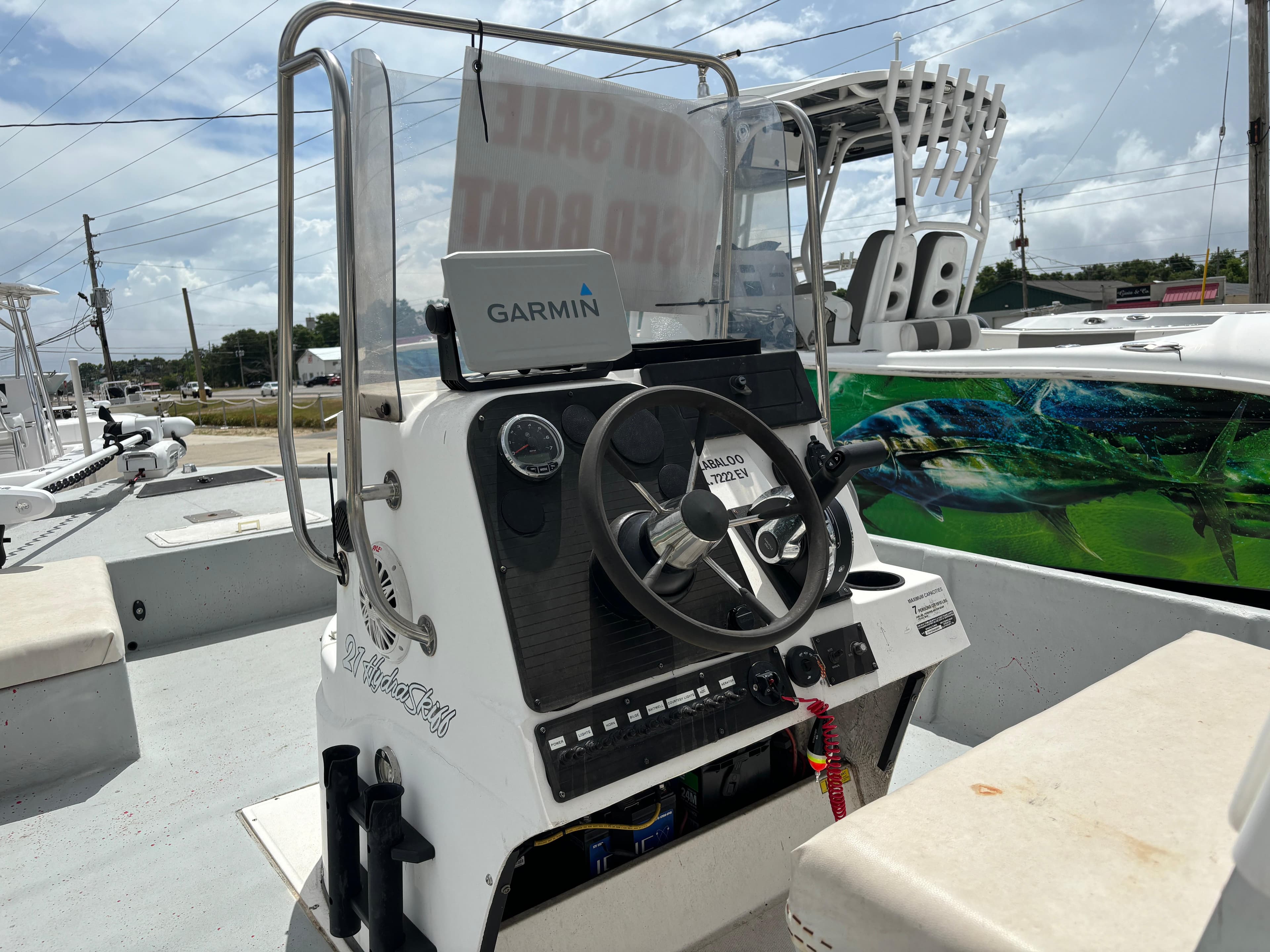 1997 Hydra-Sports 21 boat console with Garmin GPS, steering wheel, and controls.