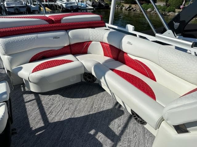 2023 JC SportToon 24 TT pontoon boat with white and red seating.