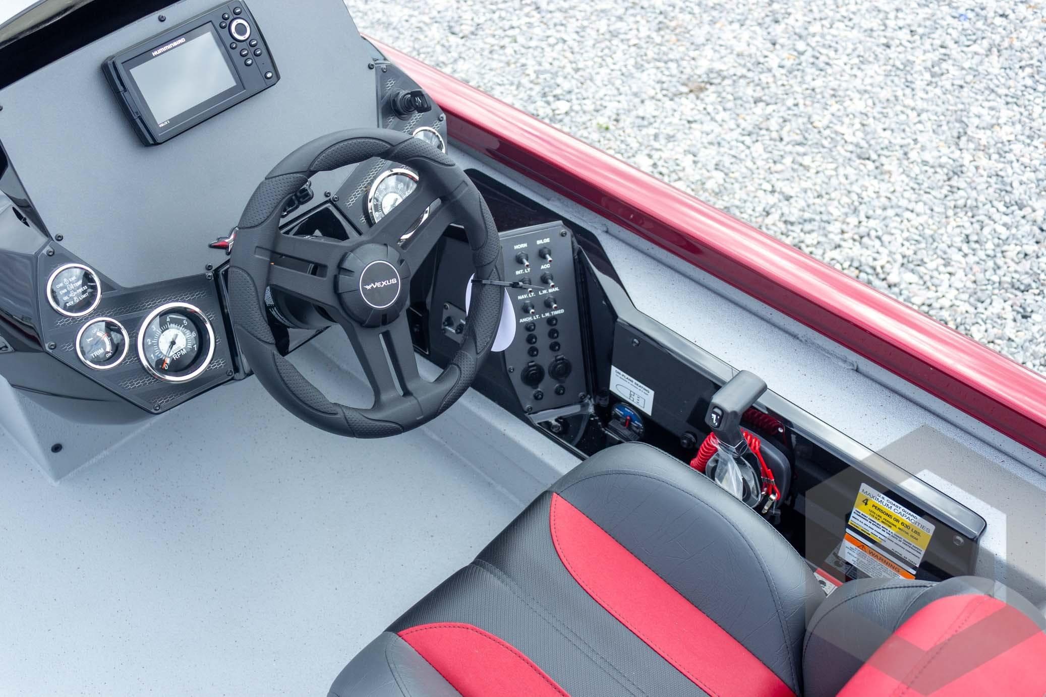 2026 Vexus Defender 189 boat cockpit with steering wheel and control panel.
