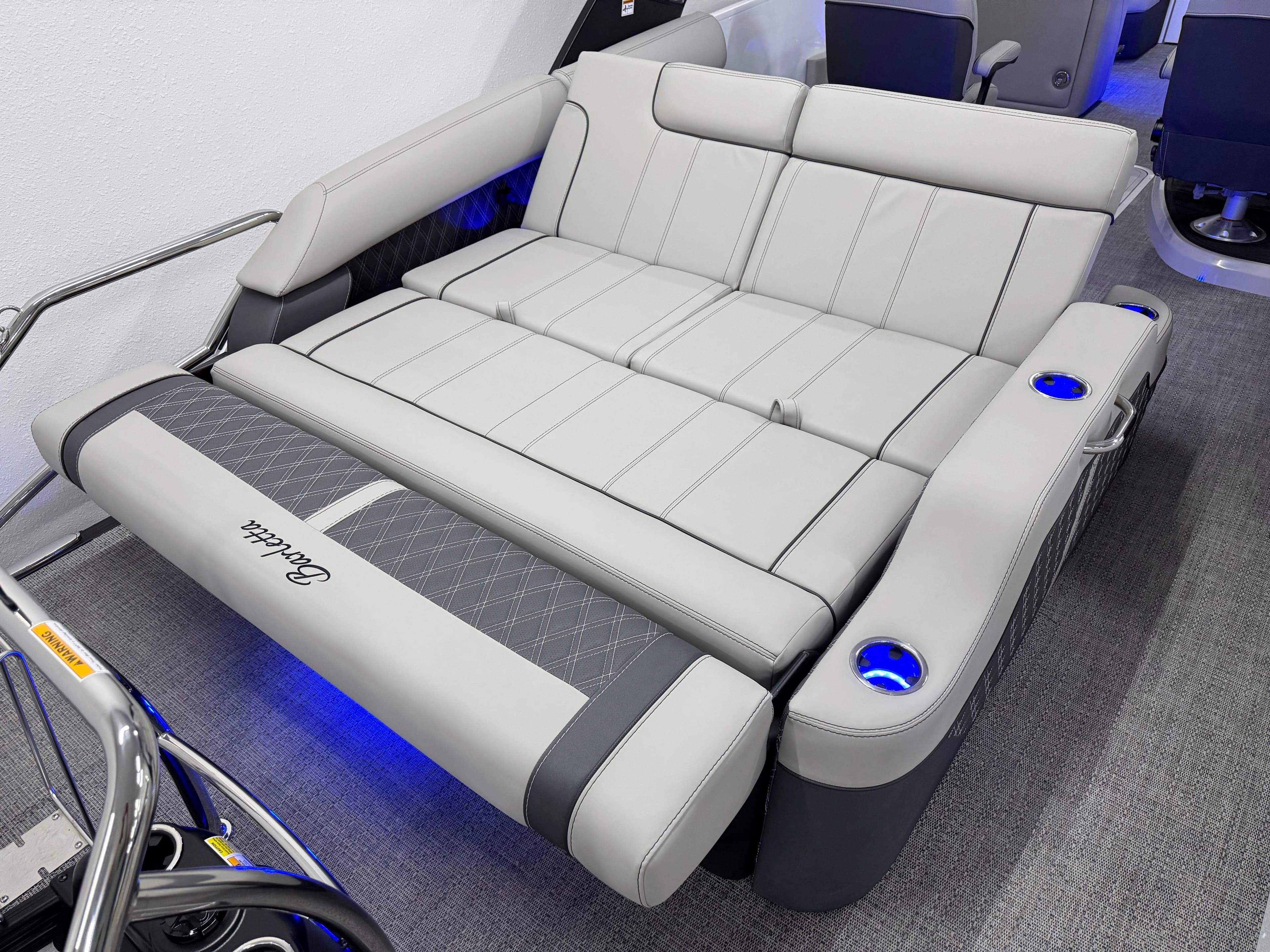 2025 Barletta Reserve Leggera R26UCA boat seating with cup holders and modern design.