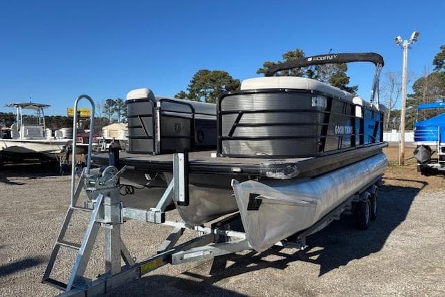 2022 Sweetwater 2286 pontoon boat on trailer in outdoor lot.