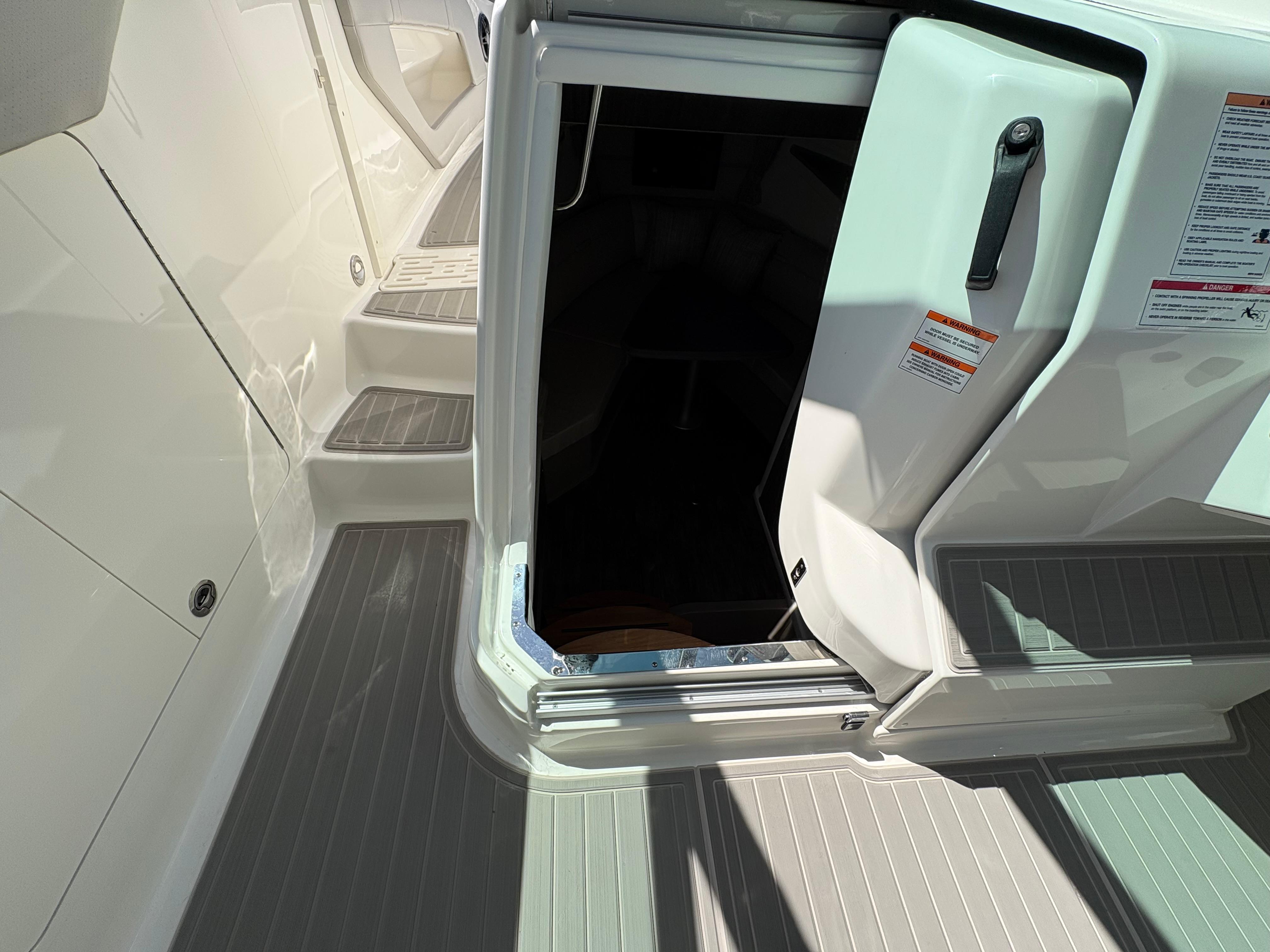 2025 Sea Ray Sundancer 320 boat entrance with open cabin door.