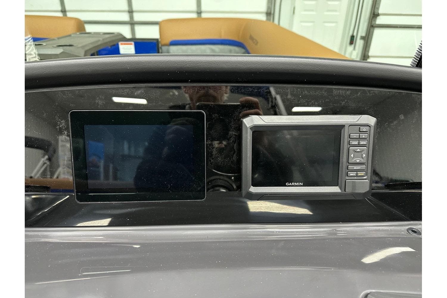 Dashboard of 2026 Bennington 22 SSB Swingback with Garmin display in stock.