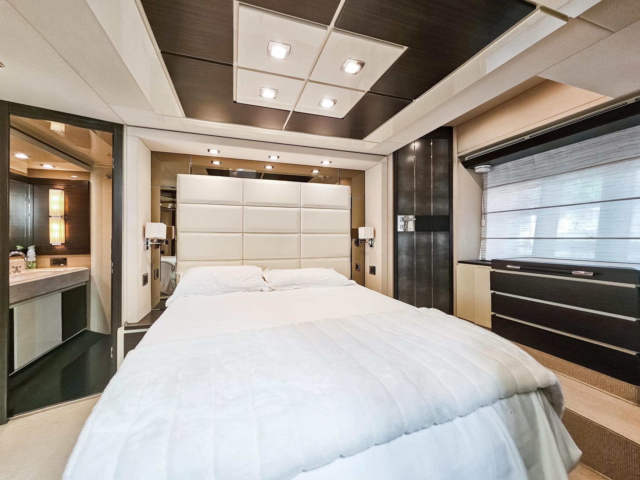 Luxurious bedroom interior of 2013 Azimut 70 yacht with modern design.