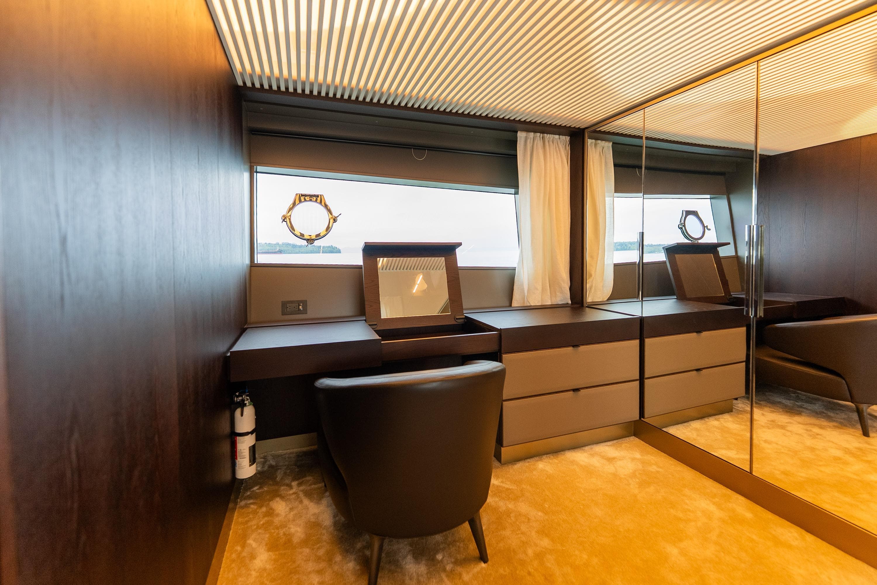 Luxurious interior of 2020 Ferretti Yachts 850 with elegant furnishings and mirrored accents.