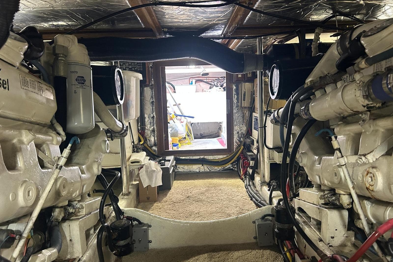 Engine room of 1994 Ocean Alexander 520 Pilothouse yacht, showcasing mechanical components.