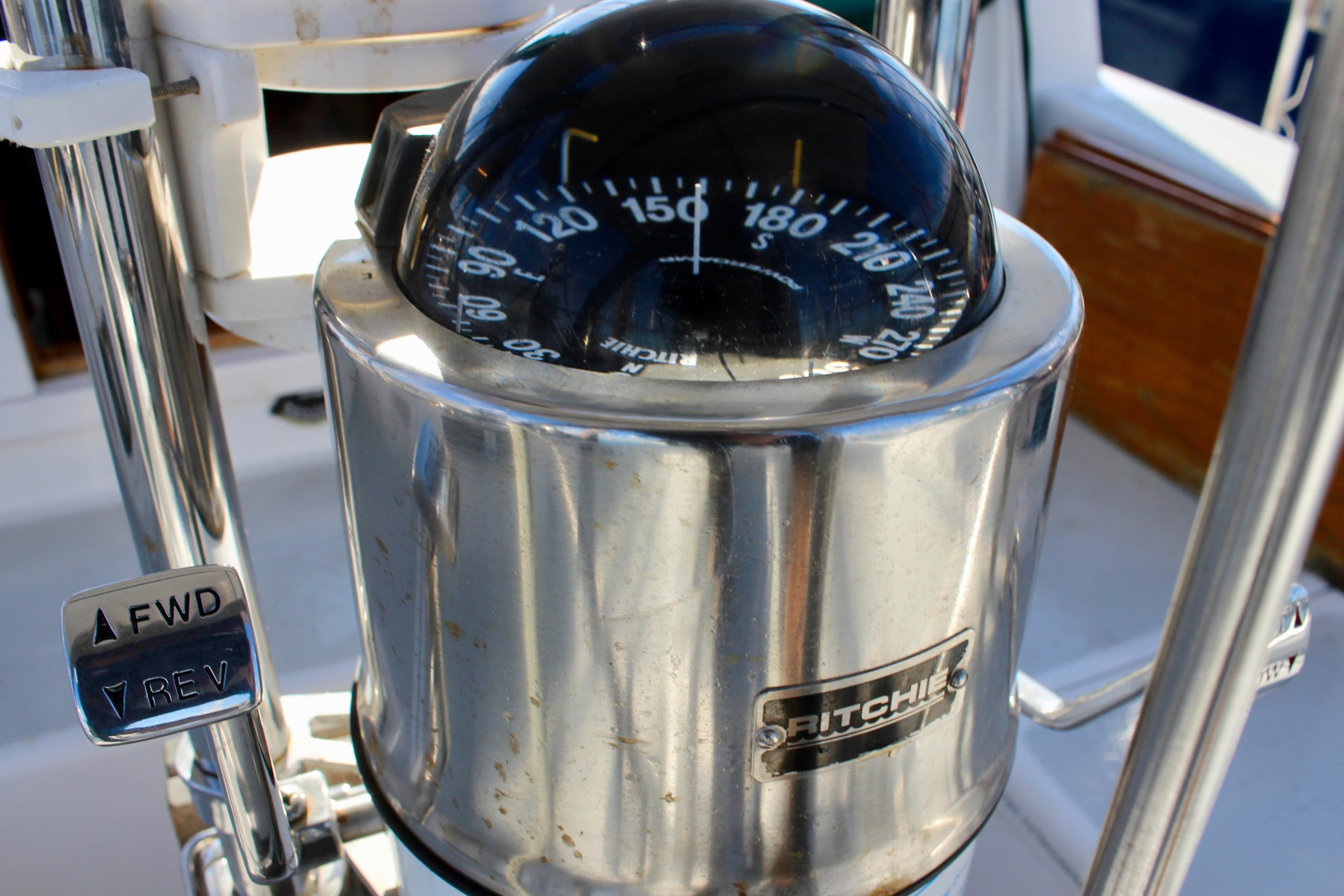 Compass and controls on a 1997 Valiant 39 sailboat.