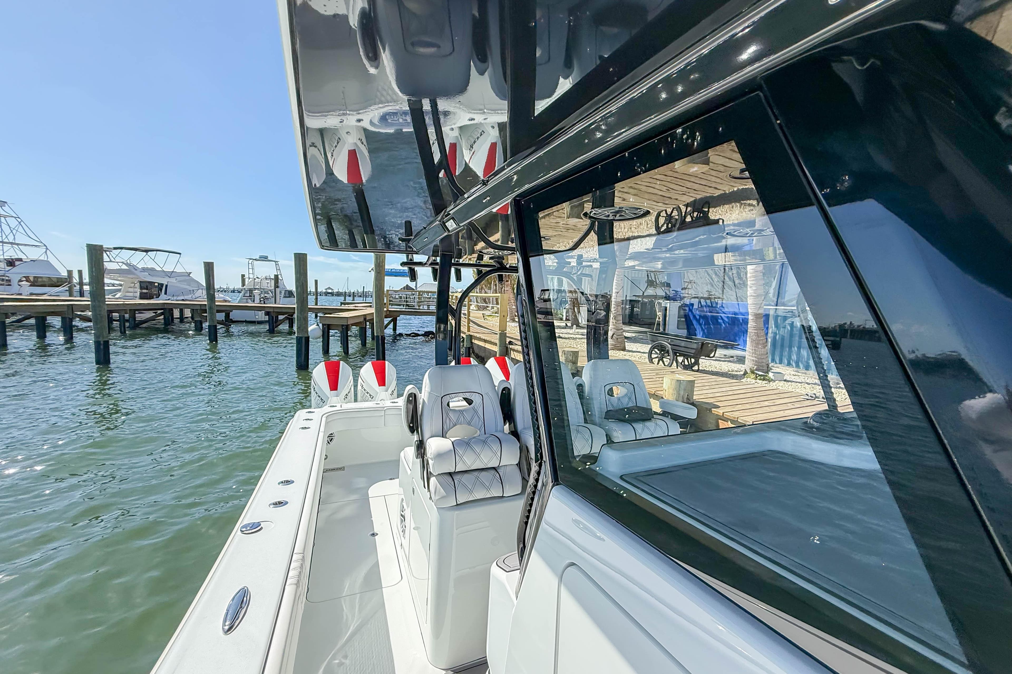 2023 Costa Custom Boats 34 docked, showcasing sleek design and modern features.