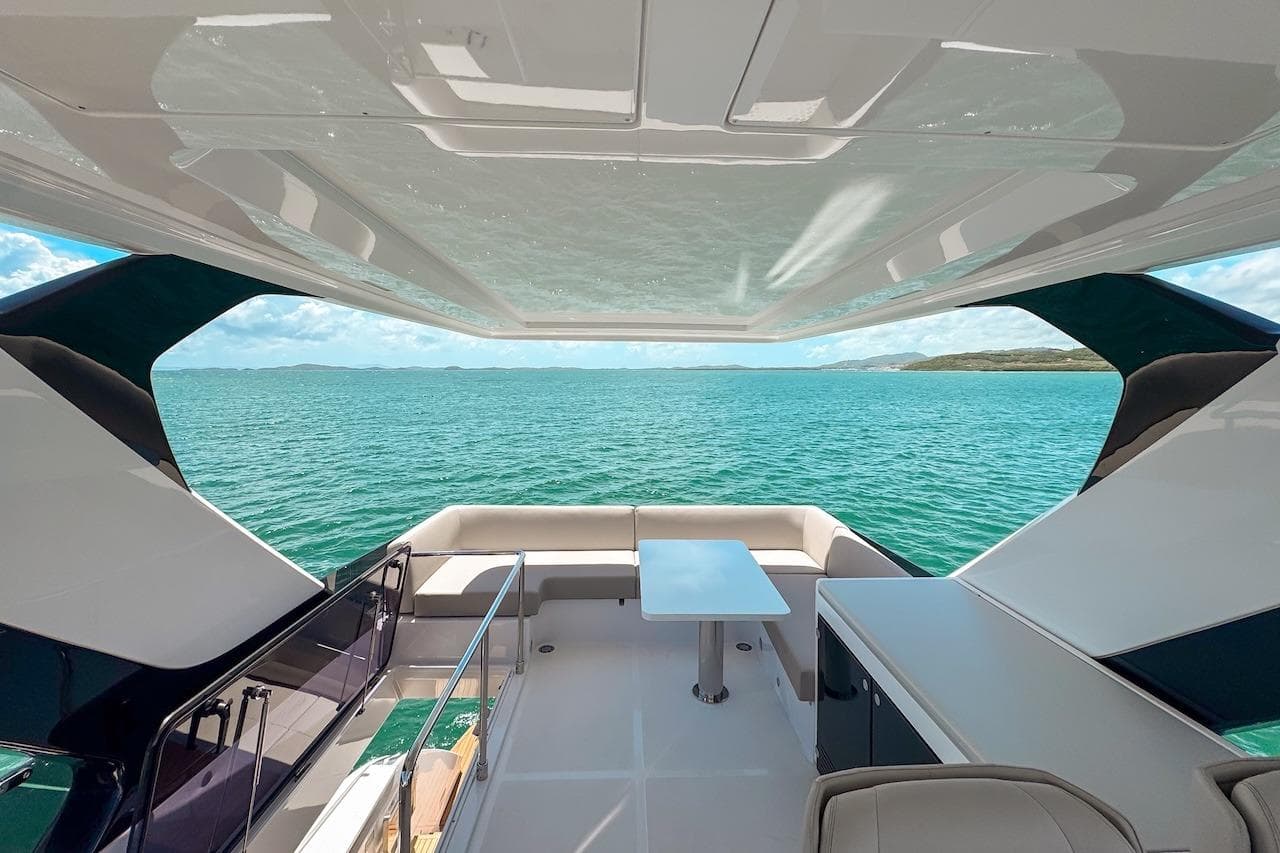 Luxurious 2024 Ferretti Yachts 580 interior with ocean view and sleek design.