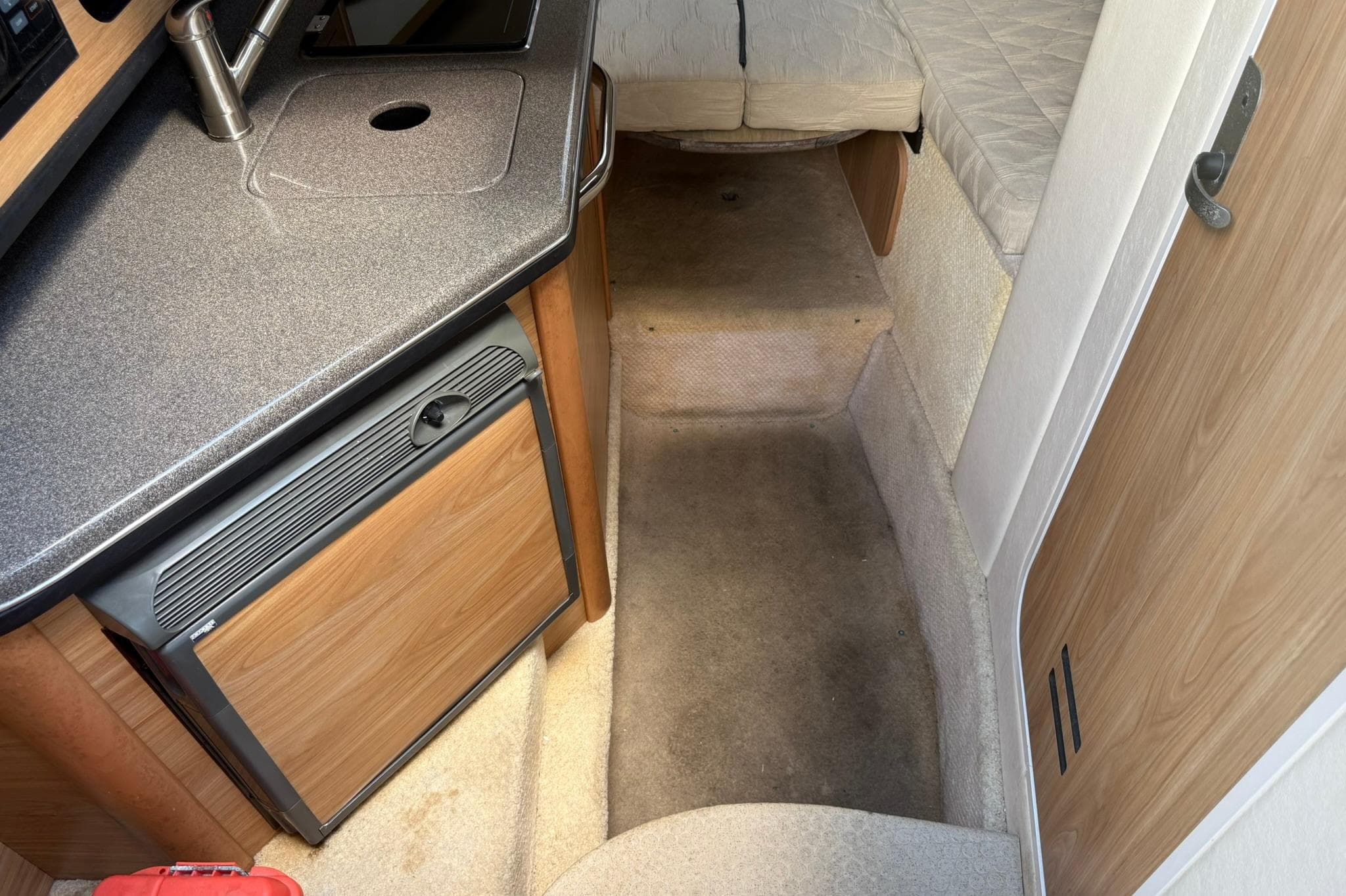 2006 Sea Ray 270 Amberjack cabin interior with kitchenette and sleeping area.