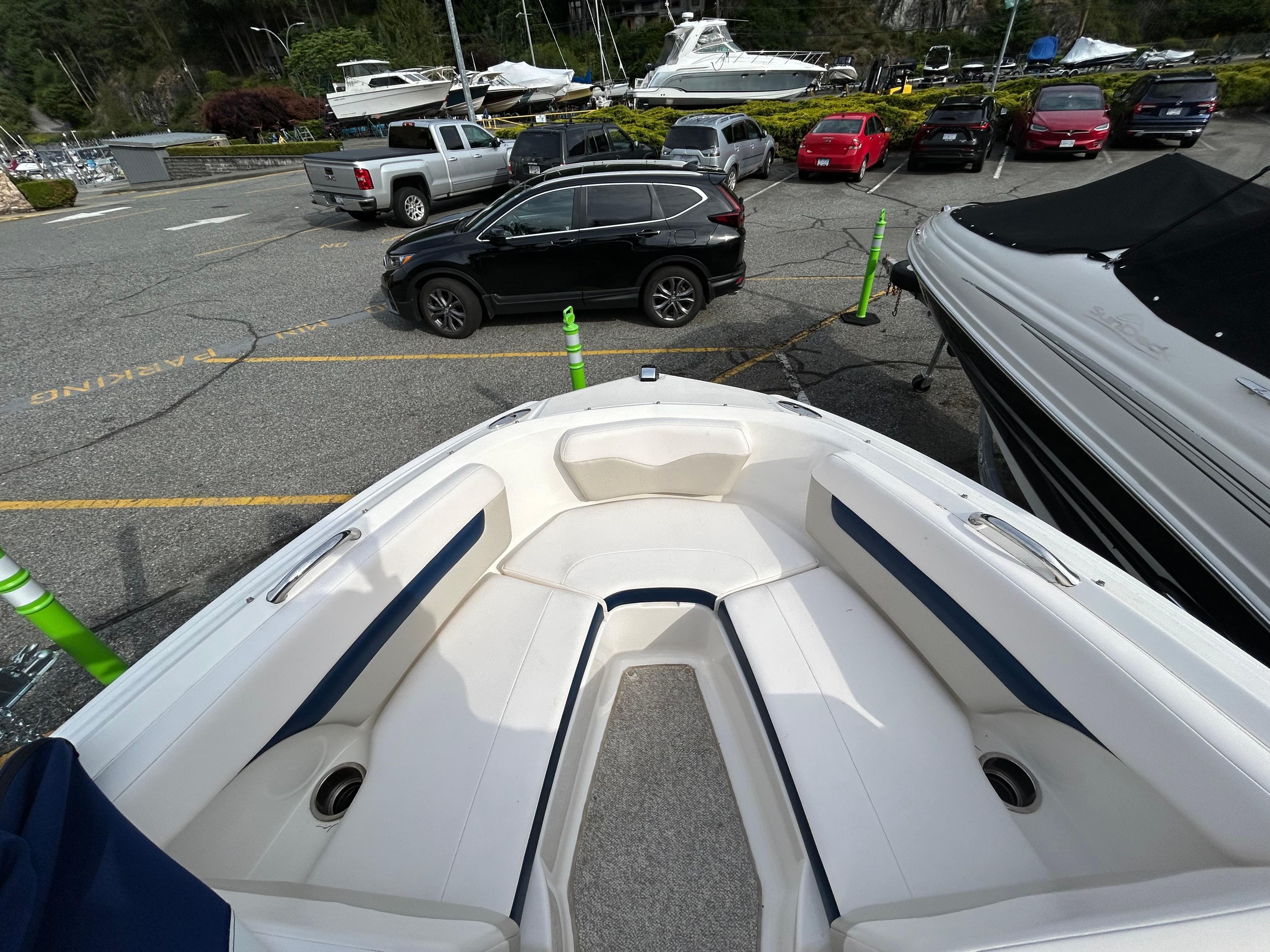 Bow view of 2010 Chaparral 186 SSi boat in a parking lot.