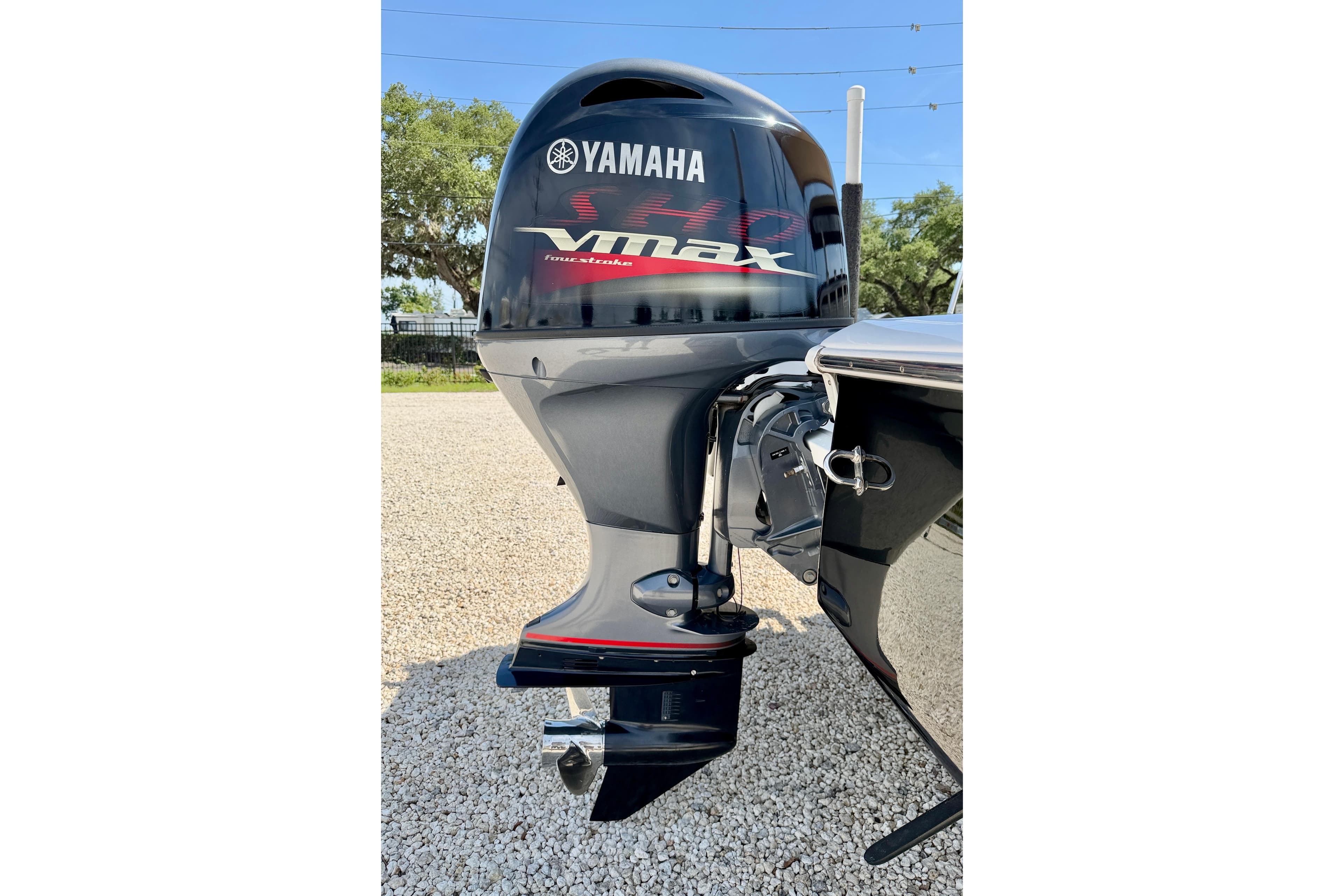Yamaha VMAX outboard motor on 2021 Tidewater 1910 Bay Max boat, parked outdoors.