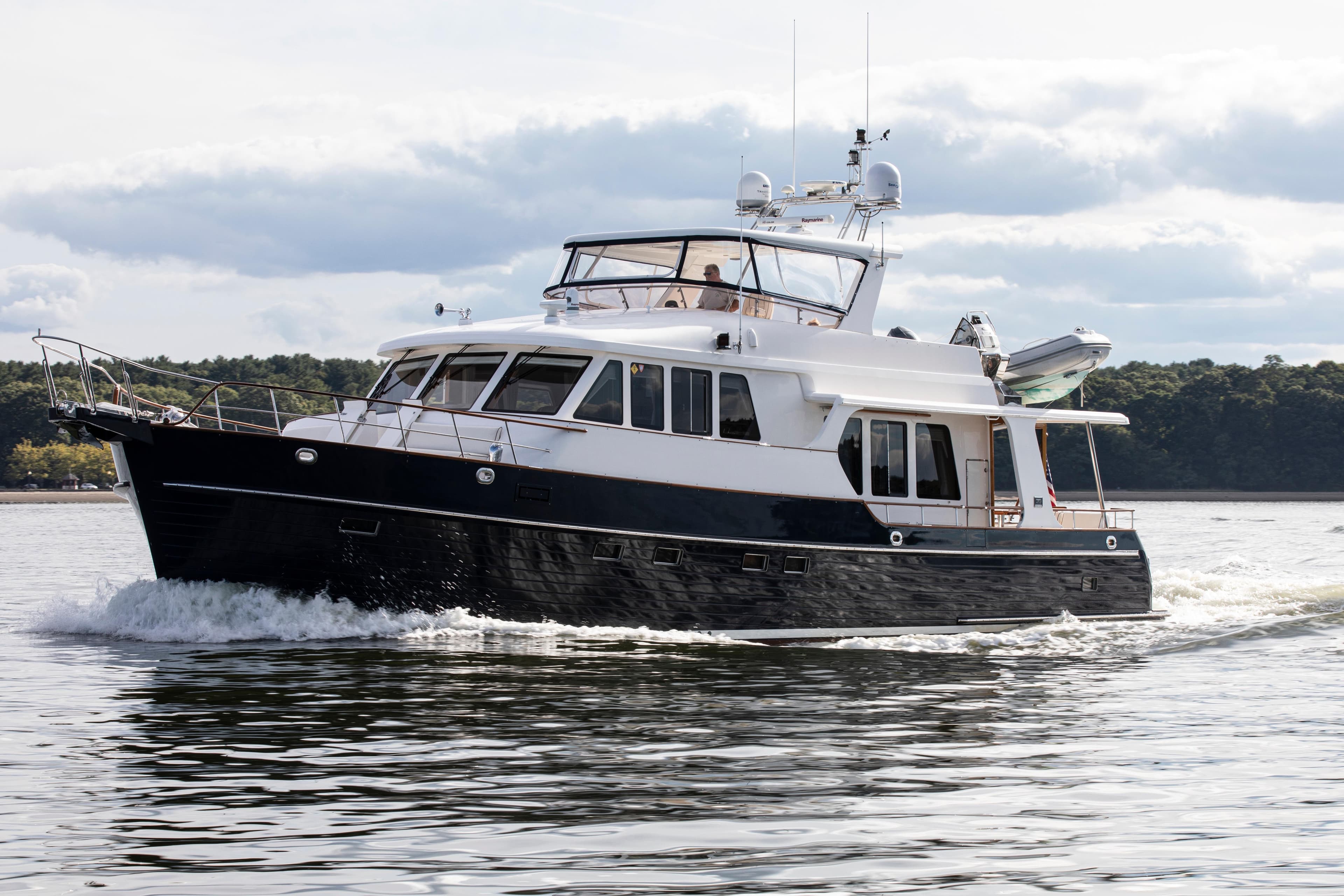 2006 Grand Banks 59 Aleutian RP yacht cruising on calm waters.